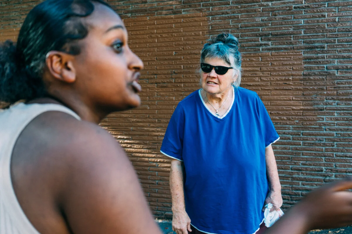 A student from Seattle Public Schools confronts a heckler on the street during a protest supporting DACA recipients and their families.