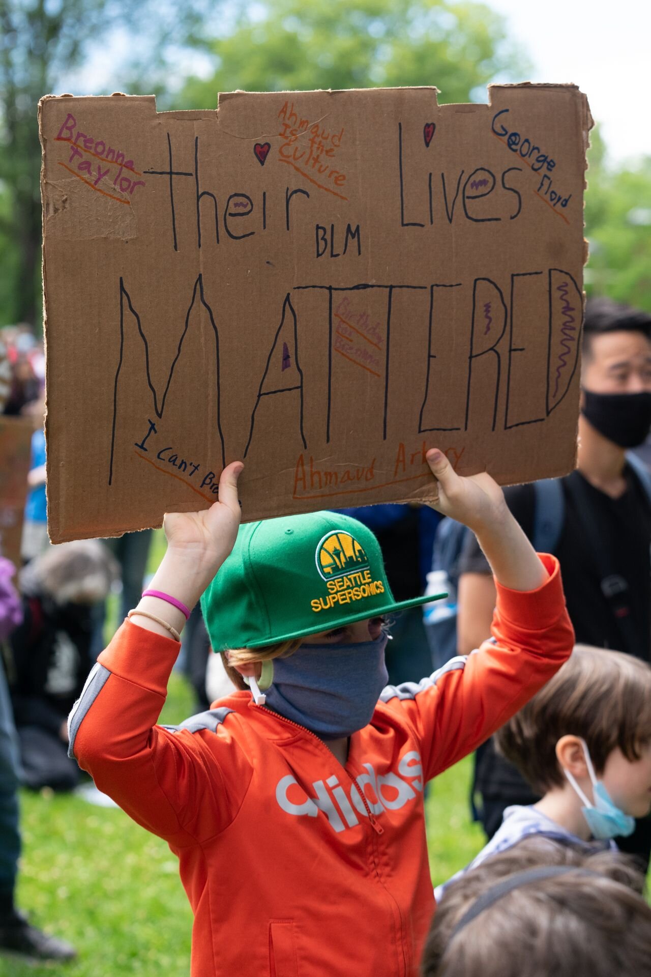  An elementary student holds a handmade sign at the Seattle Children’s March organized by youth in response to police violence and the death of George Floyd in Seattle, Wash. June 13, 2020 