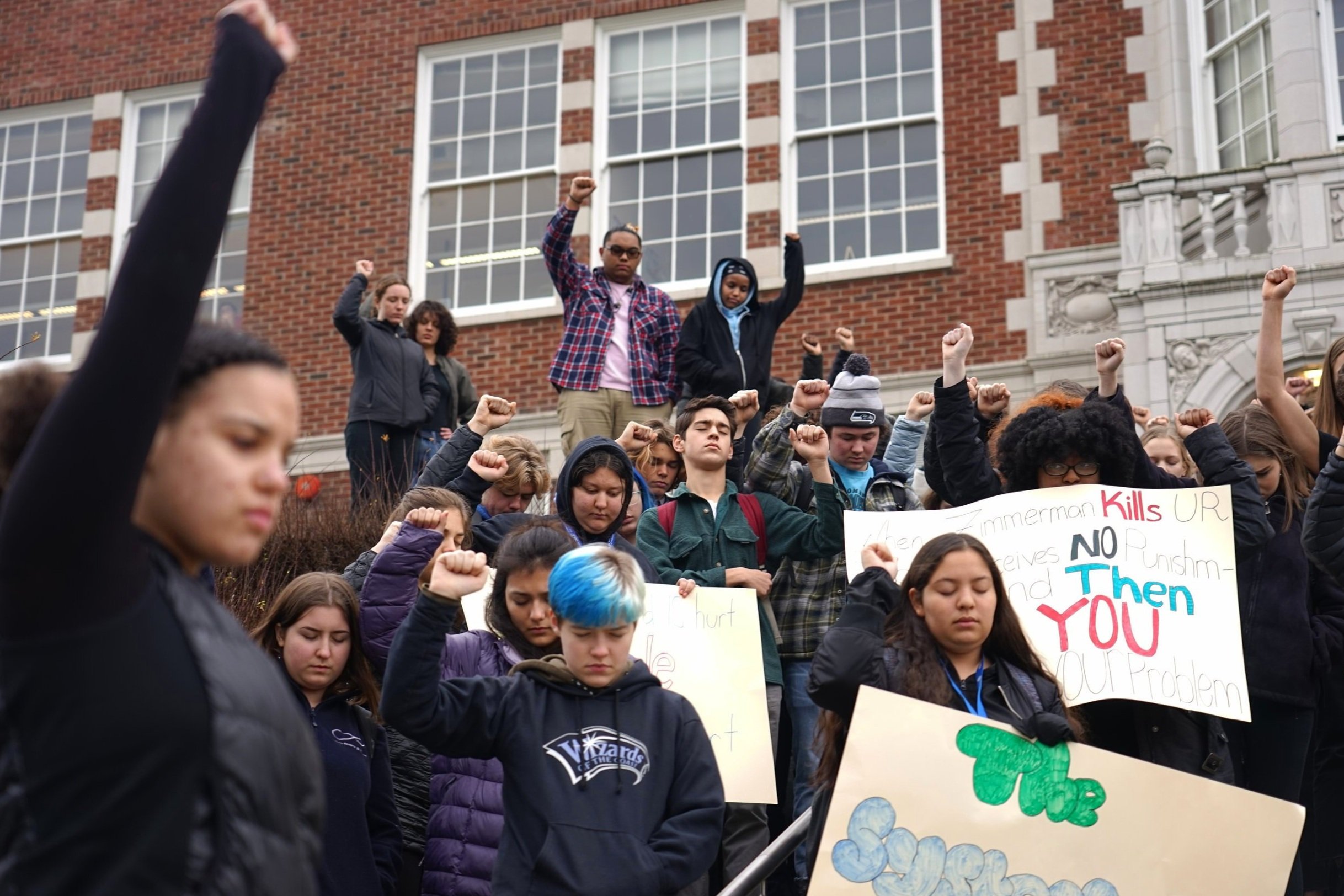  Students at Garfield High School raise their fists during a moment of silence for Trayvon Martin and his family after the announcement that George Zimmerman will be suing the family for 100 million dollars. December 22, 2019 in Seattle, Wash.  