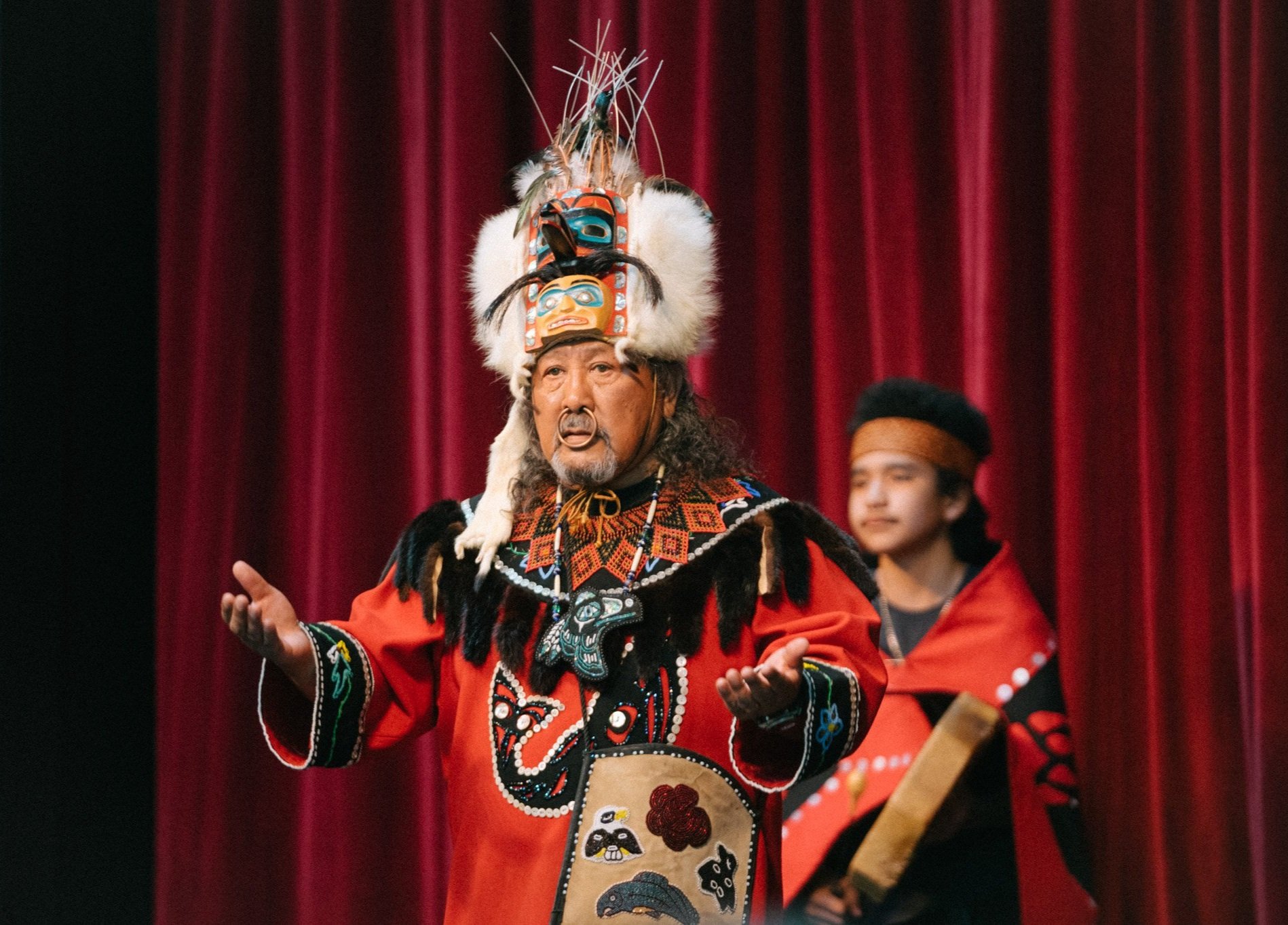  Tiny Barril of the Tlingit Tribe leads multiple generations in traditional song and dance at the Seattle Center on June 11, 2022.  