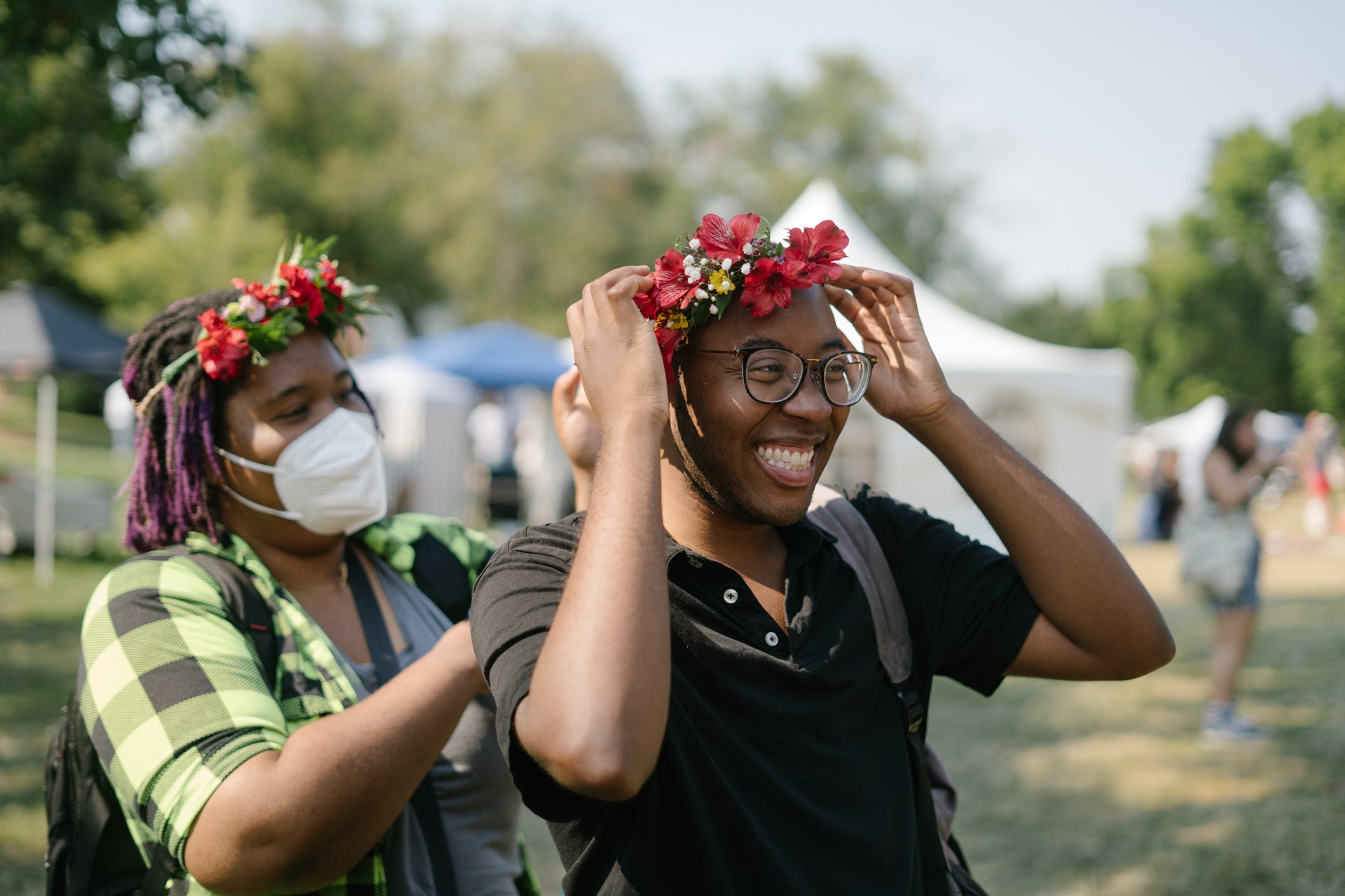  Black, Trans writers wear free flower crowns at the Black Trans Family Reunion picnic, August 2023.  