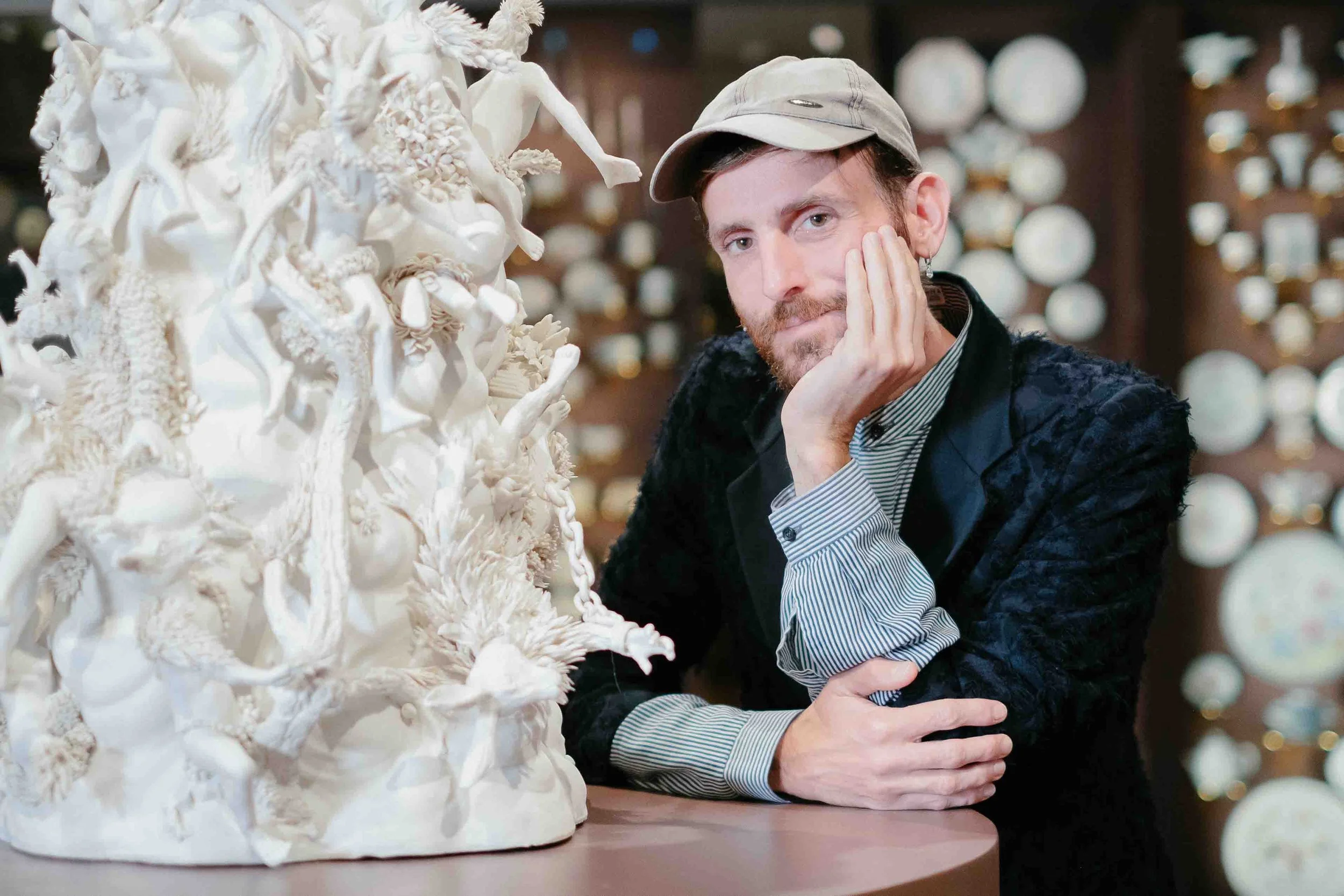  Contemporary ceramics artist Diego Cibelli poses with his work at Seattle Art Museum on May 28, 2024. 