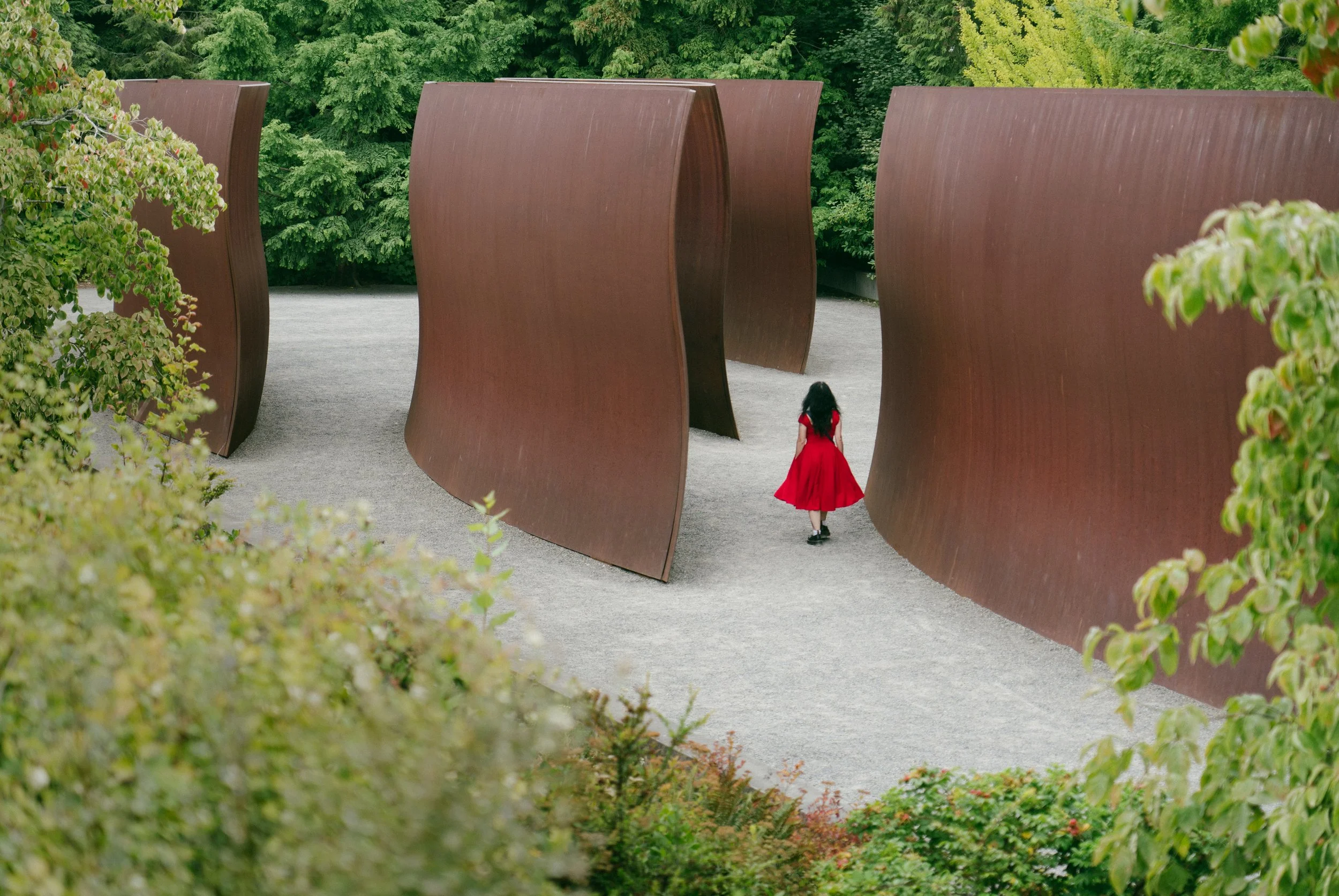  A red dress stands out against the background of Richard Serra’s ‘Wake’ installation at Seattle’s Olympic Sculpture Park,  