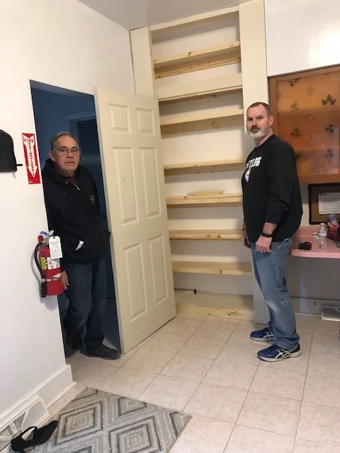 Construction volunteers building a pantry