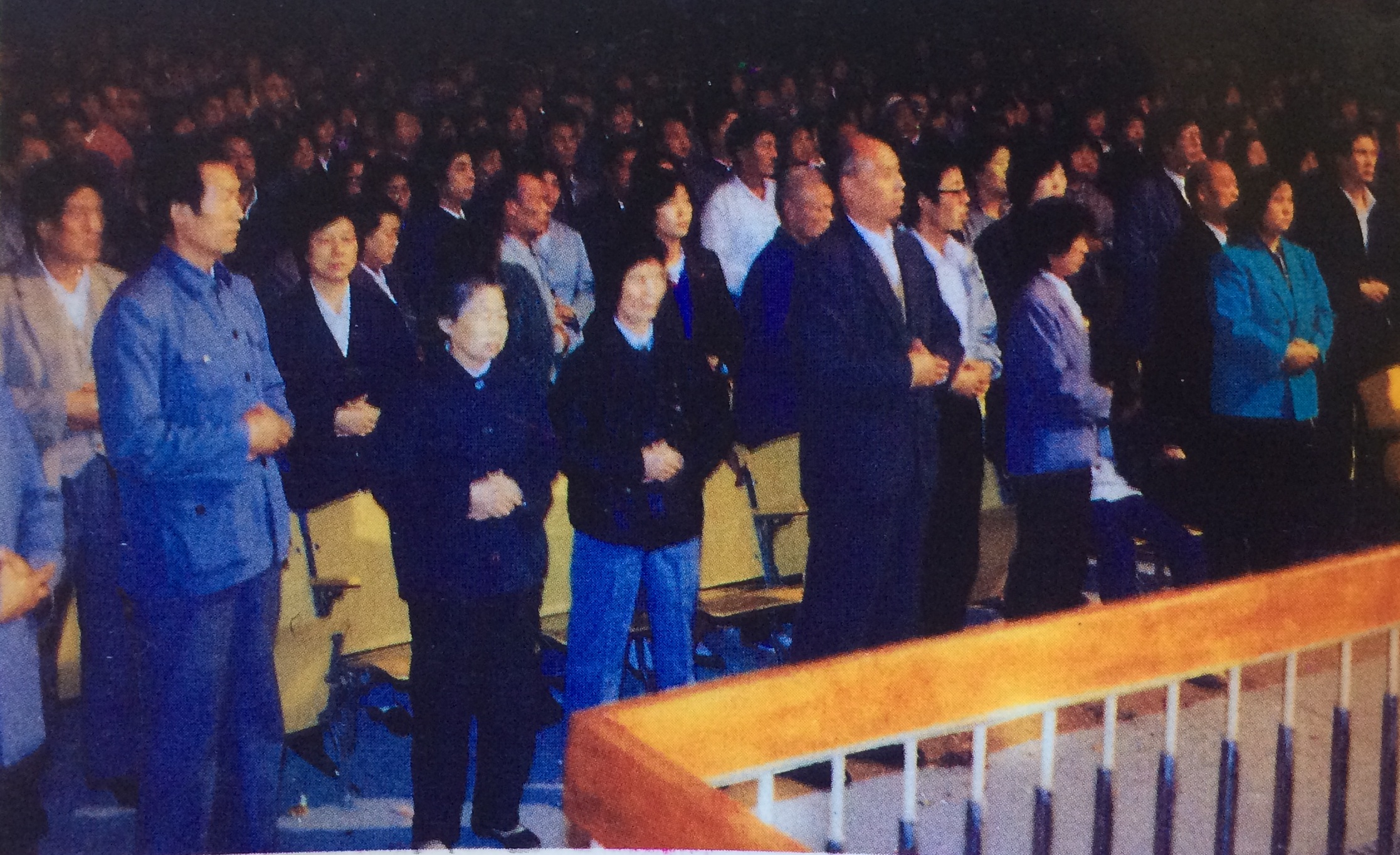 In Xi'an, China: More than three thousands people taking Taoist Light Qigong class at a time. Class held in University Auditorium.
