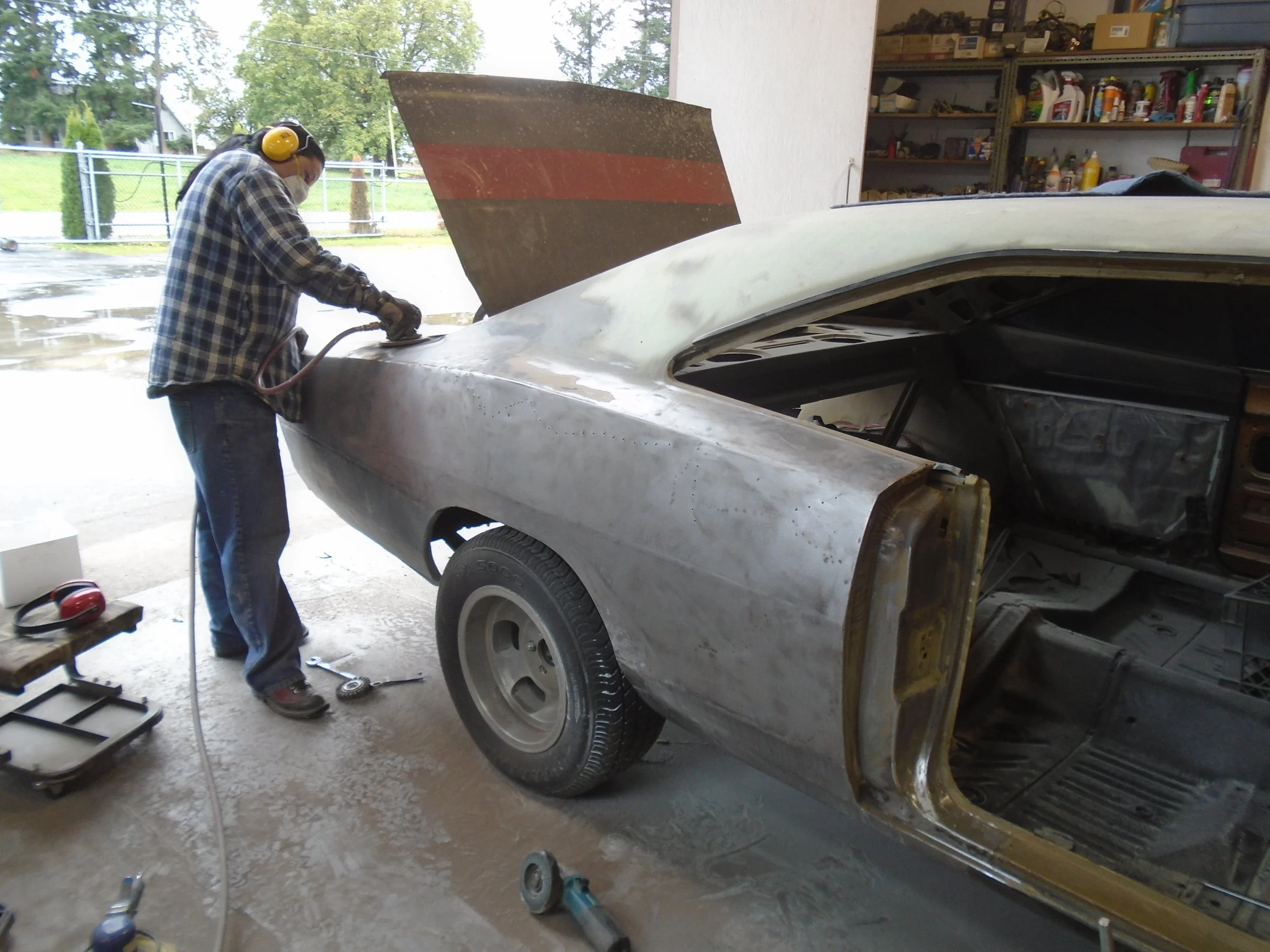  We couldn't in good faith leave all that bondo on the car.&nbsp; The customer decided to go gloss black instead of flat black on the paint so now we step up our game and machine it straight - no hand blocking as the customer didn't want to spend the