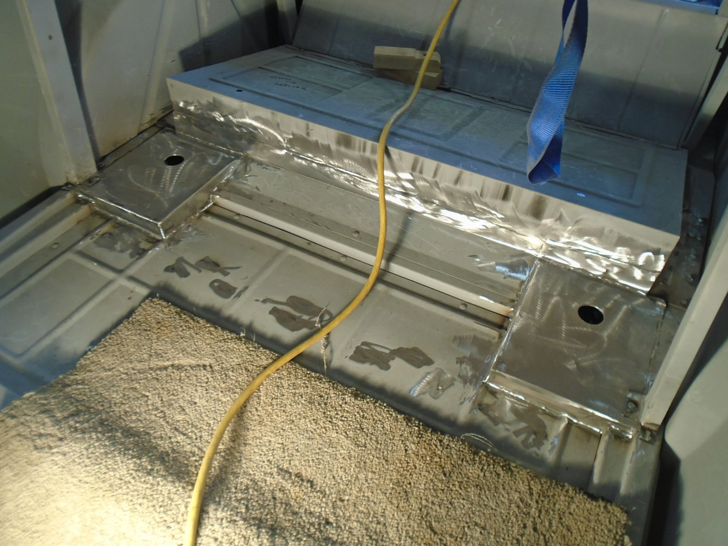  And here is what it looks like after some fabrication to fit over the frame.&nbsp; The holes are to provide access to the shocks. 