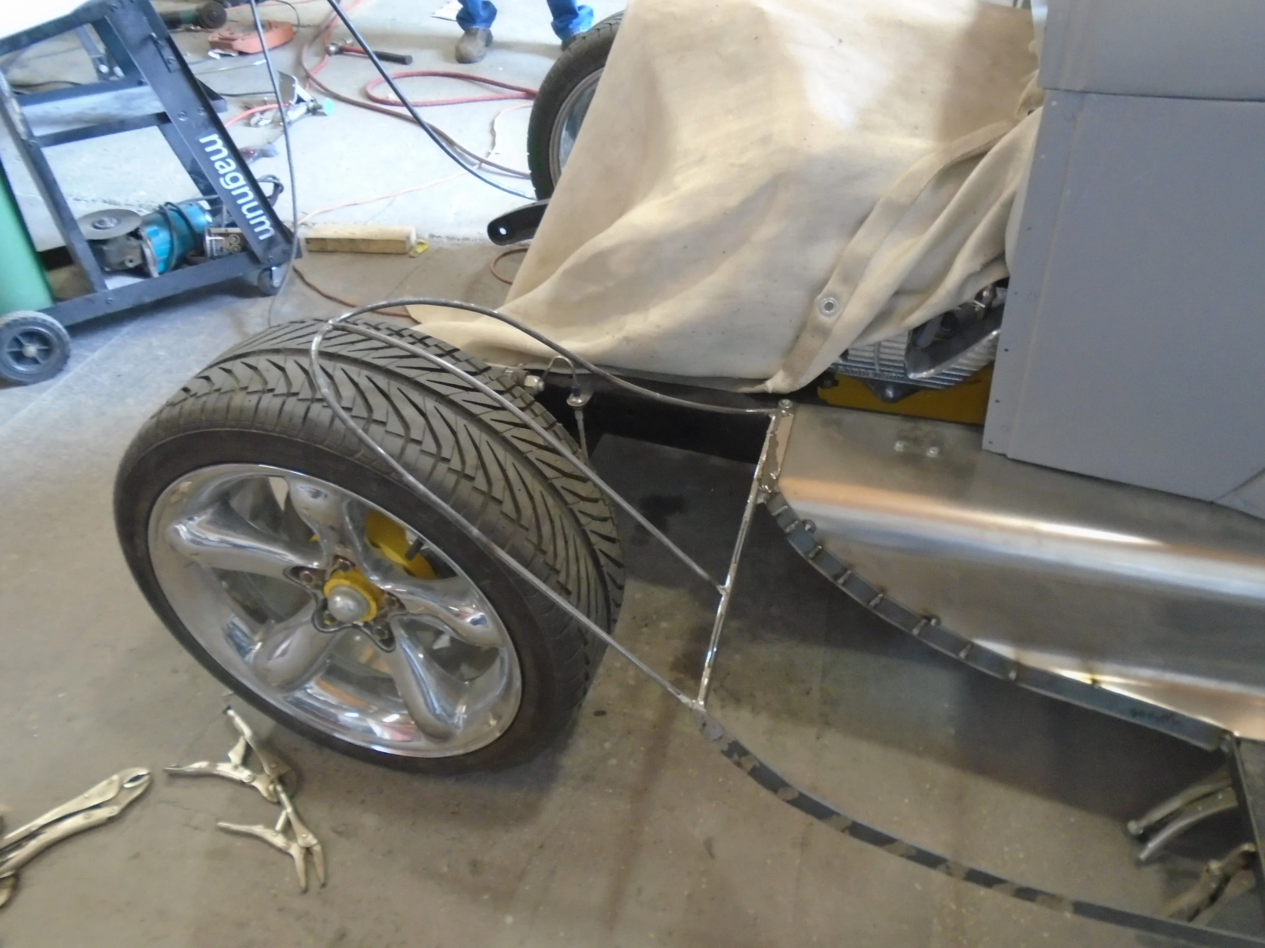  The customer wasn't sure what he wanted to do with the front fenders other than he didn't want to use the stock ones.&nbsp; Together we came up with a template and went to work making the framework for "bobber" style fenders 