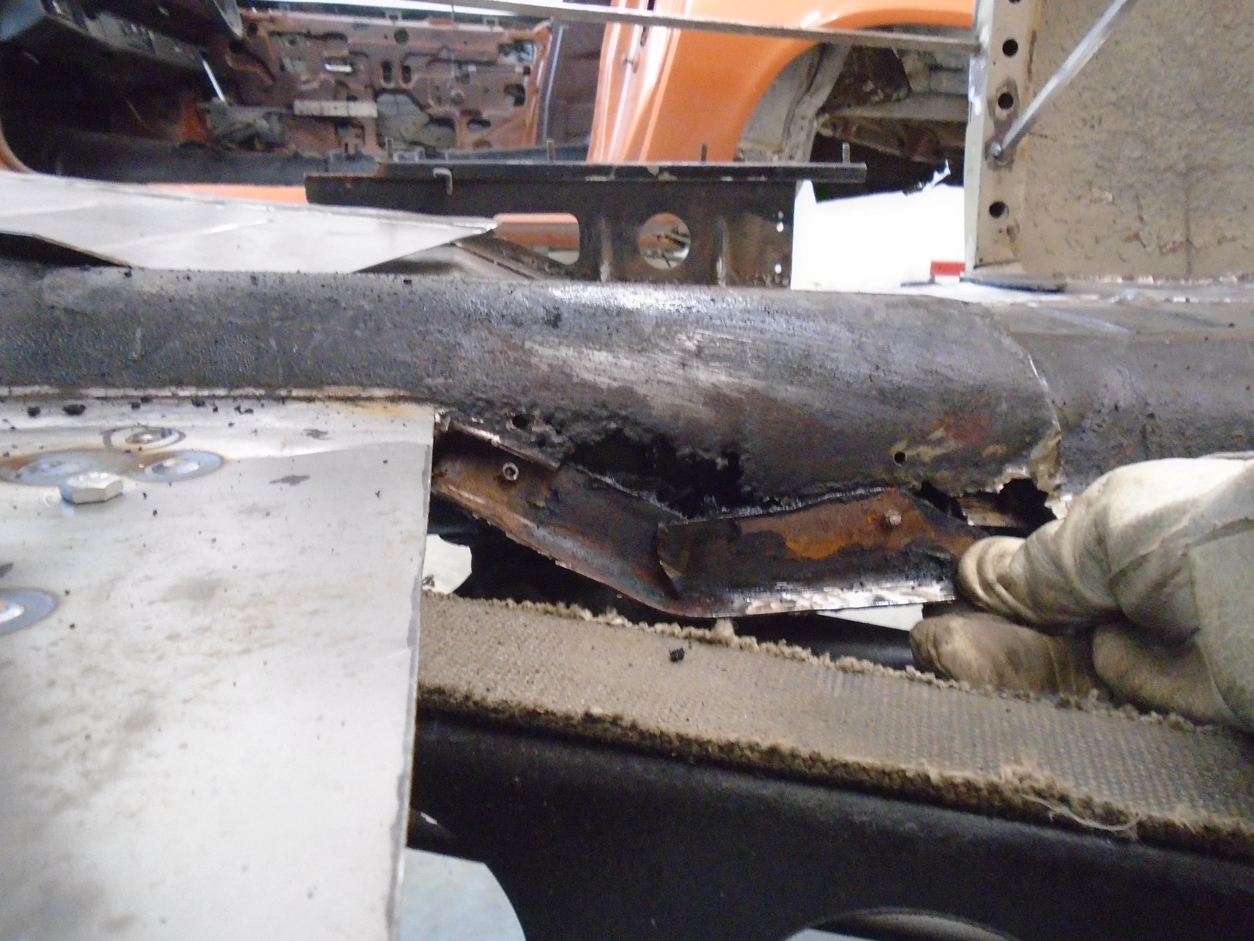  This was the previous "repair" whoever worked on this restoration in the past was a fan of the pop rivet gun..maybe no welding skills? 