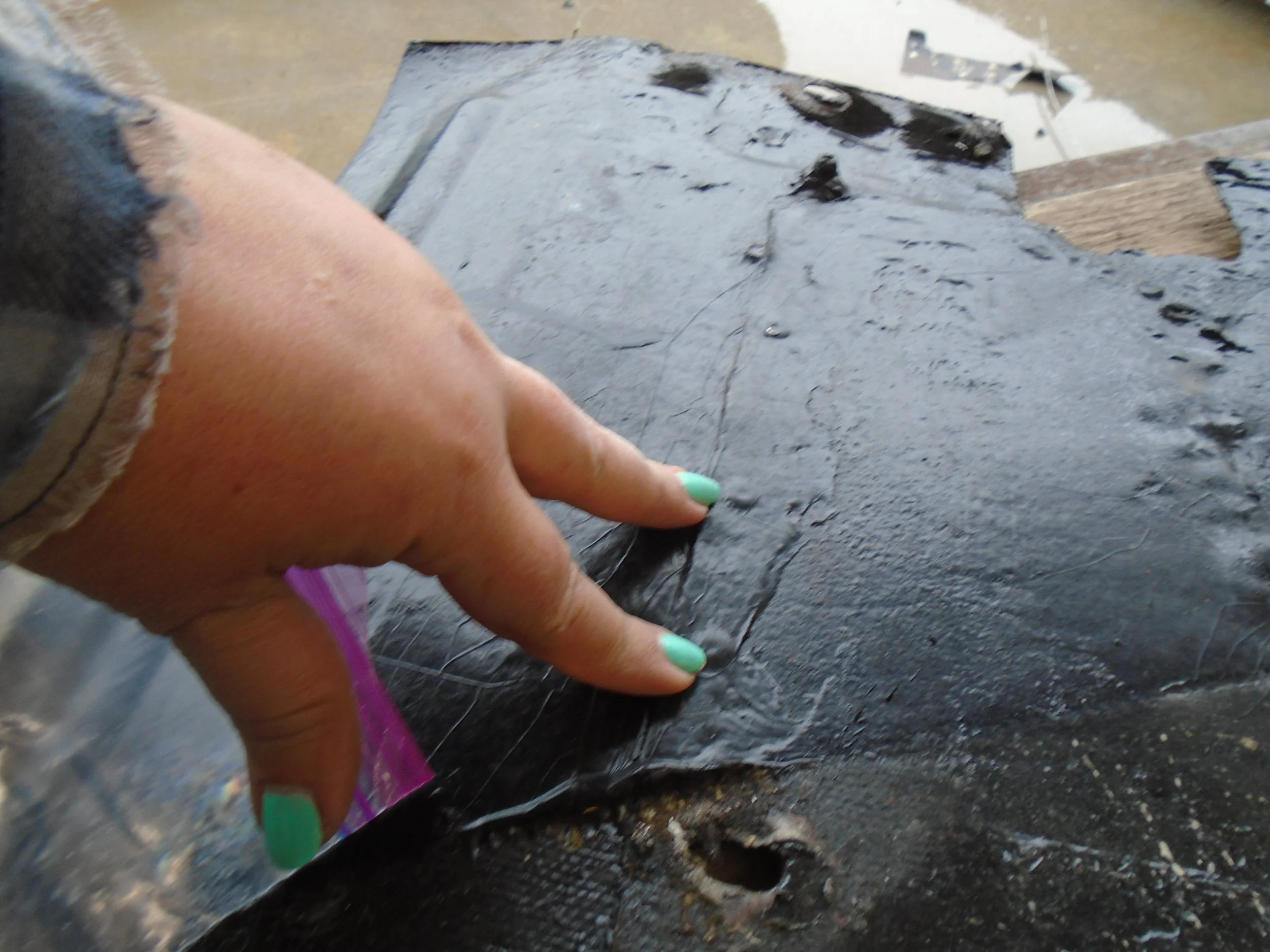  More pop rivets smothered in roofing tar....we found these everywhere! 