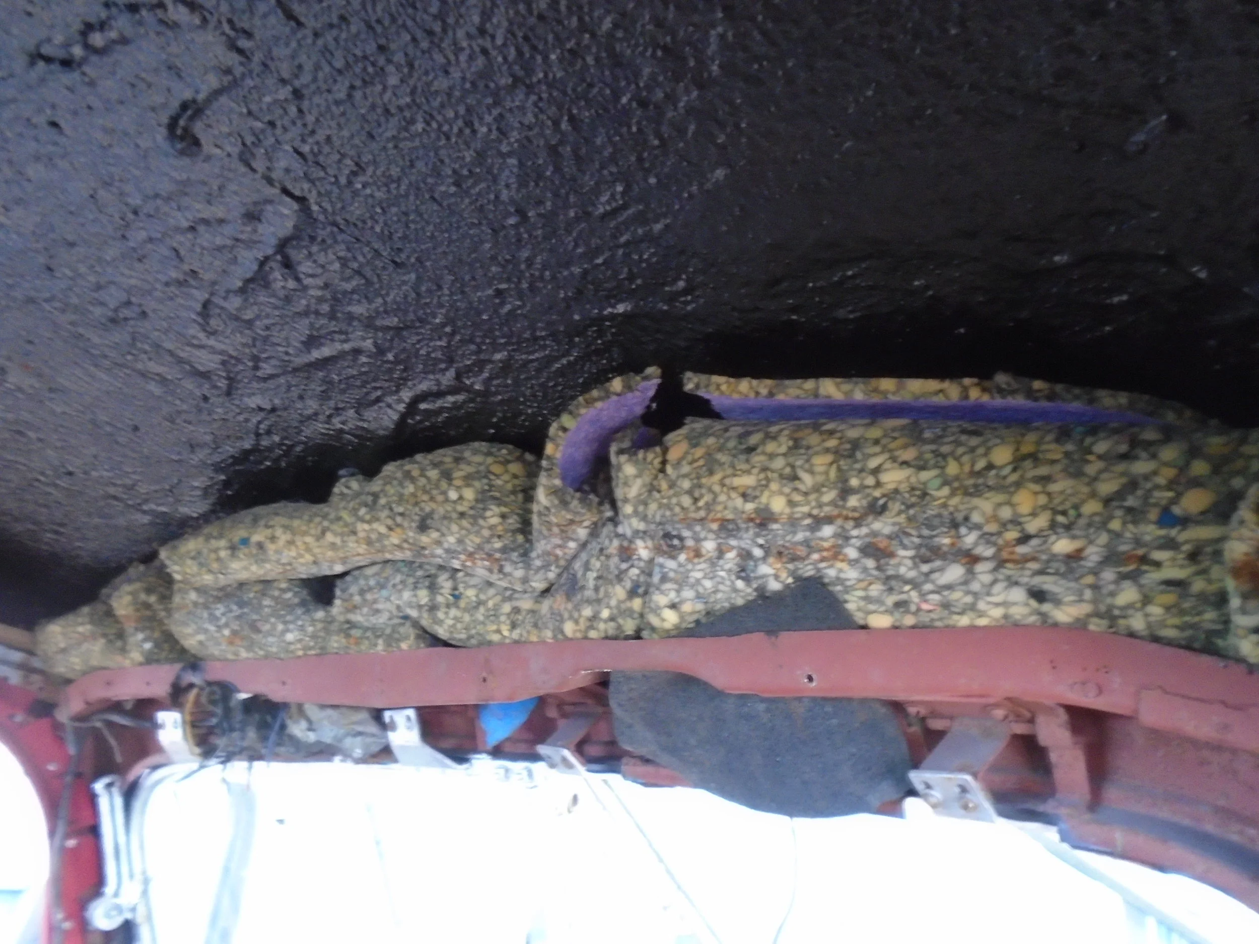  Our personal favorite find was carpet underlay used as...insulation??? in the roof above the window 