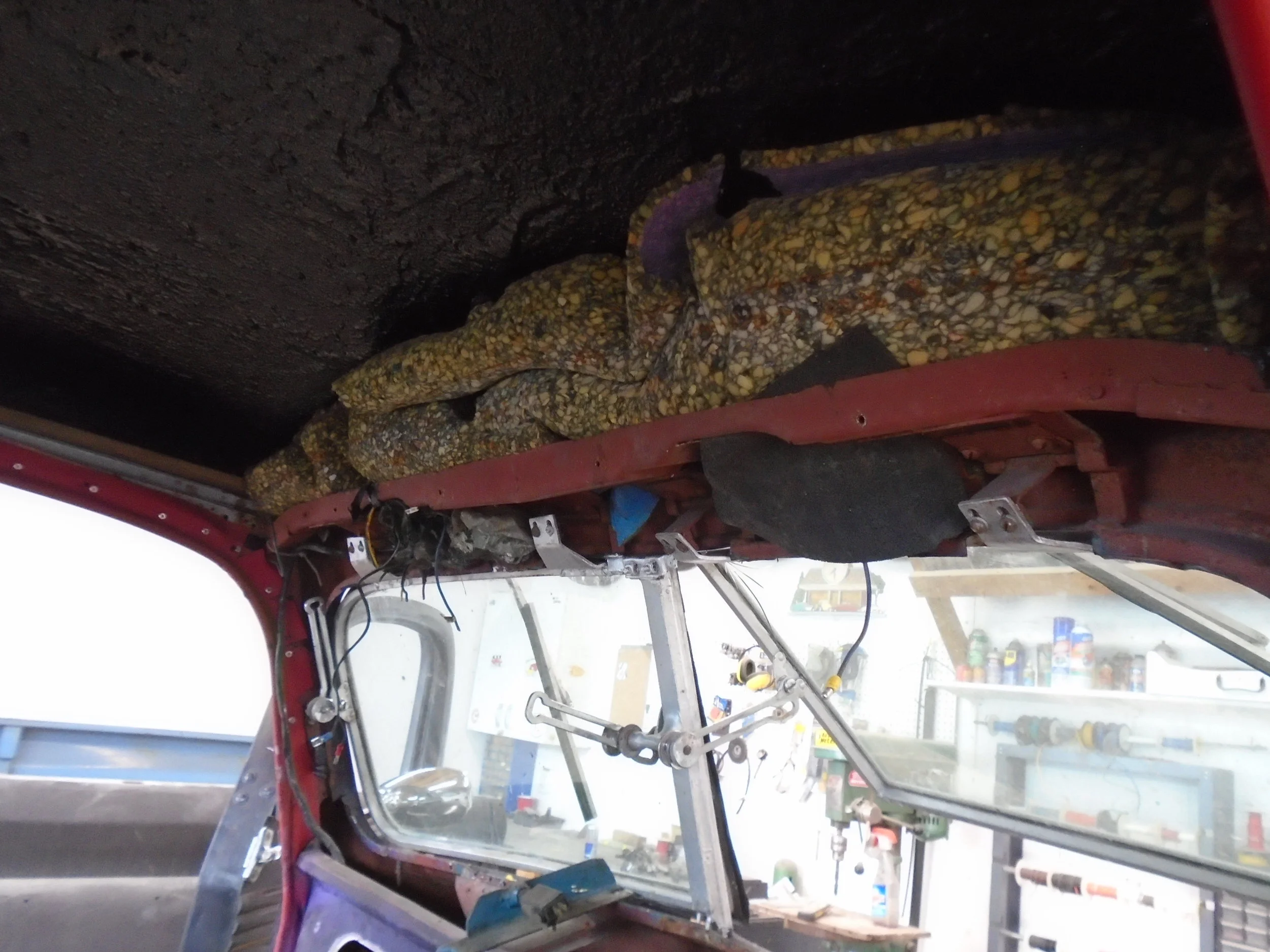  There were parts of this underlay that were pushed up into holes in the roof that then had bondo on the roof - guess that's one way to fill in a hole 