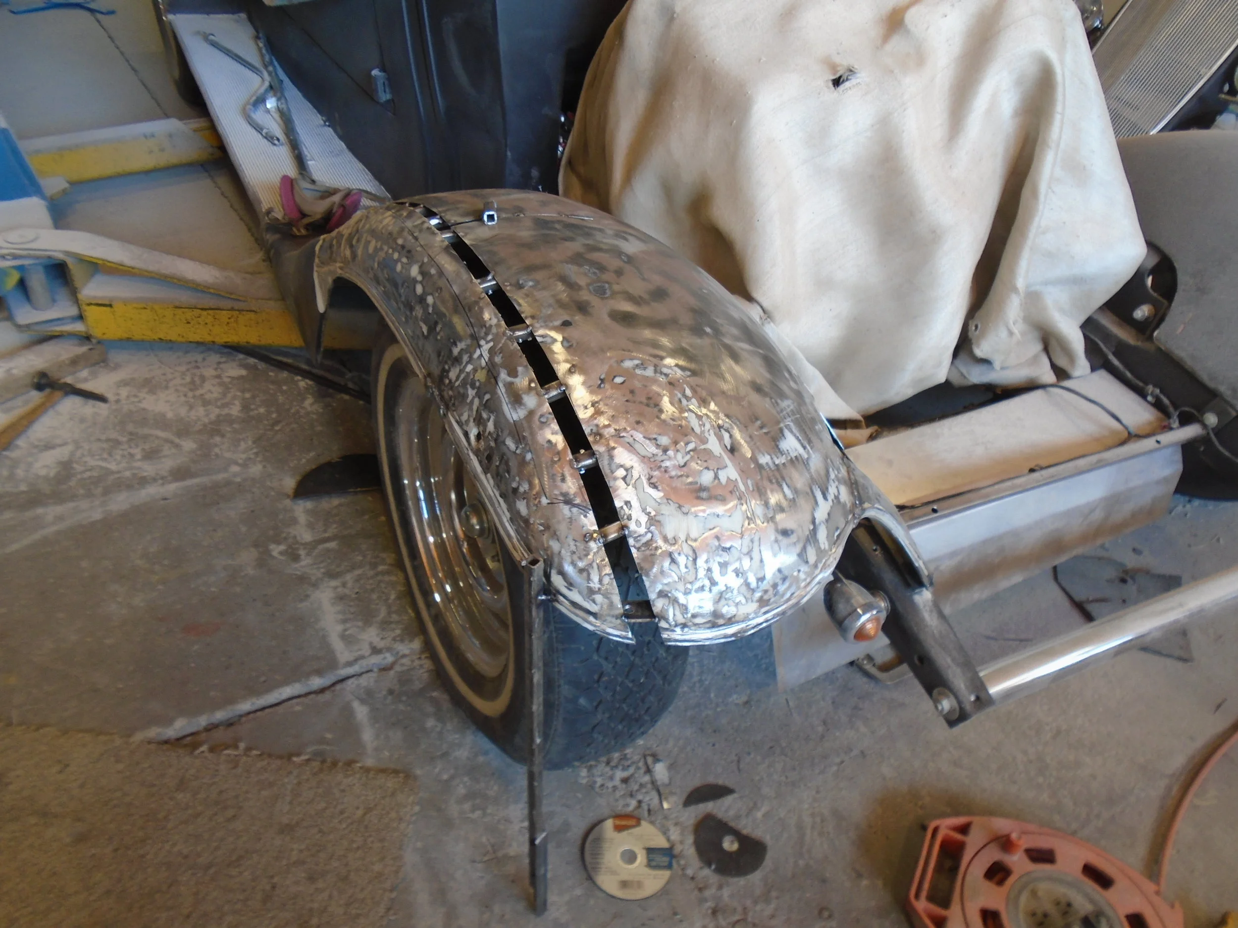  We split the fenders to fix the shape back closer to original - they were patched and patched and bondo'd which you can see in the next few pics 