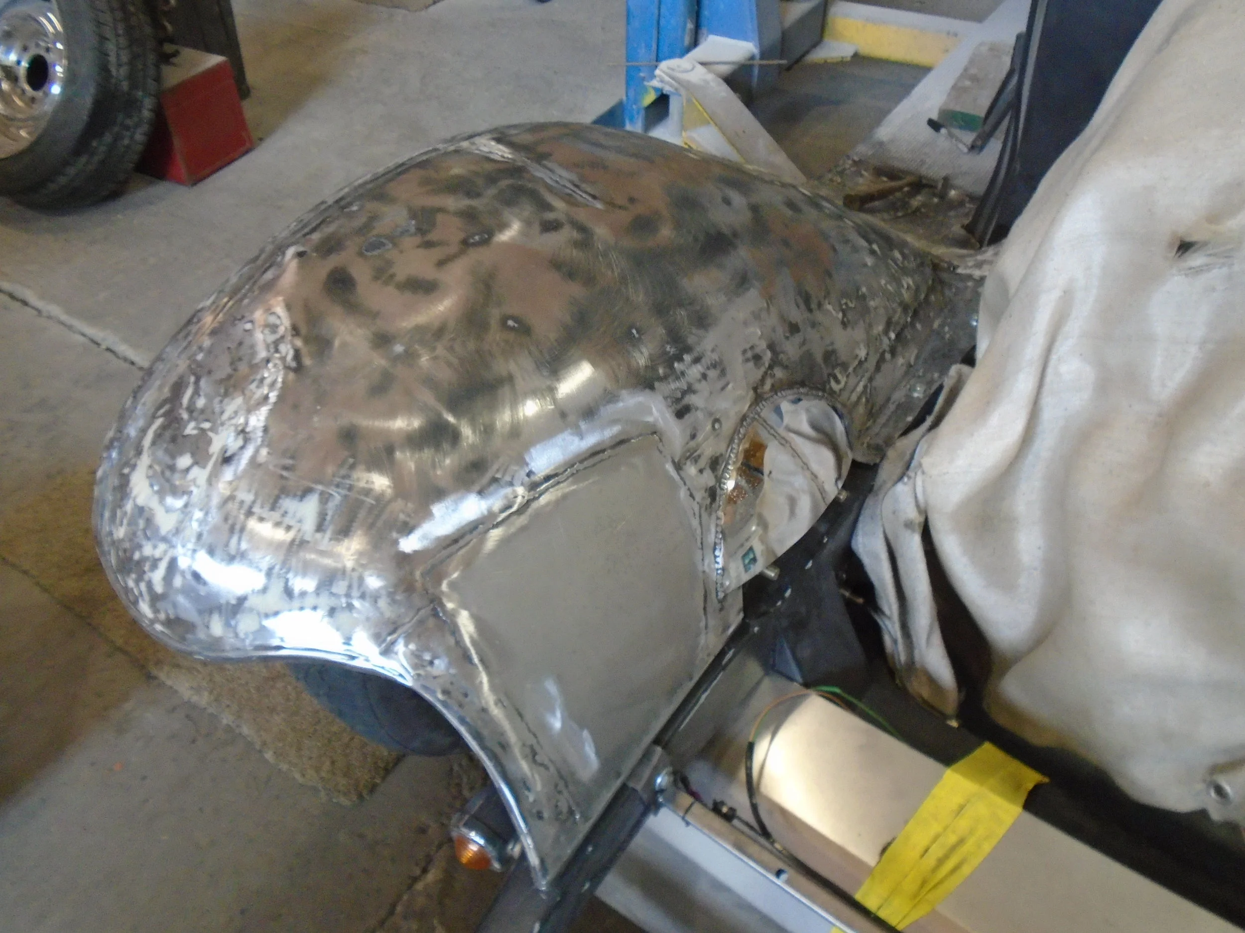  here you can see where we used a moon hubcap to make a nice adjustment to the fender to clear the brackets on the new clip&nbsp; 