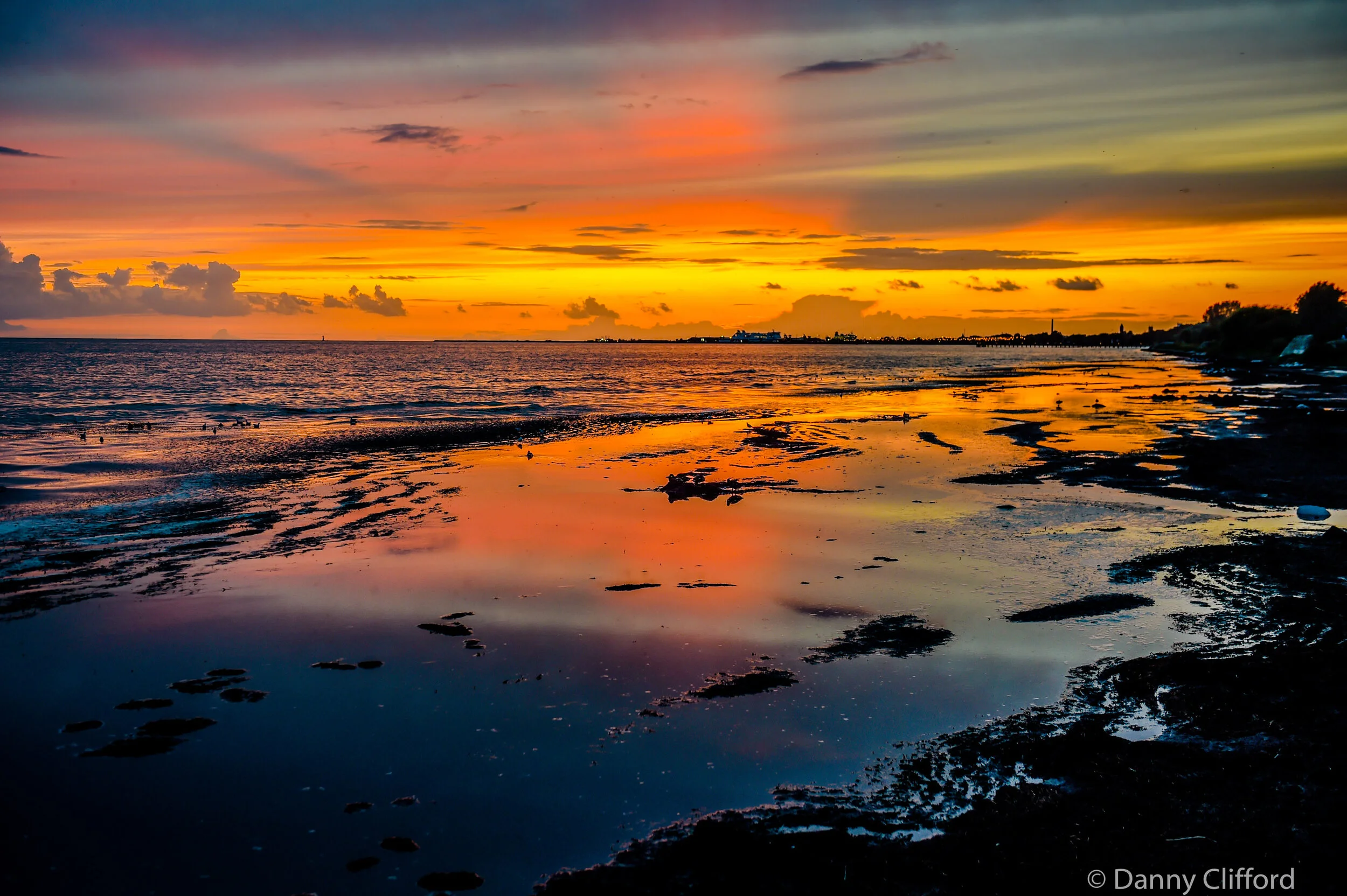 After I spoke at Malmos Fotodag, my wife, Lyn and I drove down to one of the most southerly points of Sweden. The sun was going down and I managed to get down to the beach just in time to get this sunset shot. It was very pretty. We then went for a quiet dinner and after we sat down we realised it was Kareoke bar. Nice food, noisy singers. I say singers, mostly very nice drunk Swedish people who couldnt really sing. It was a lot of fun and they were all lovely.