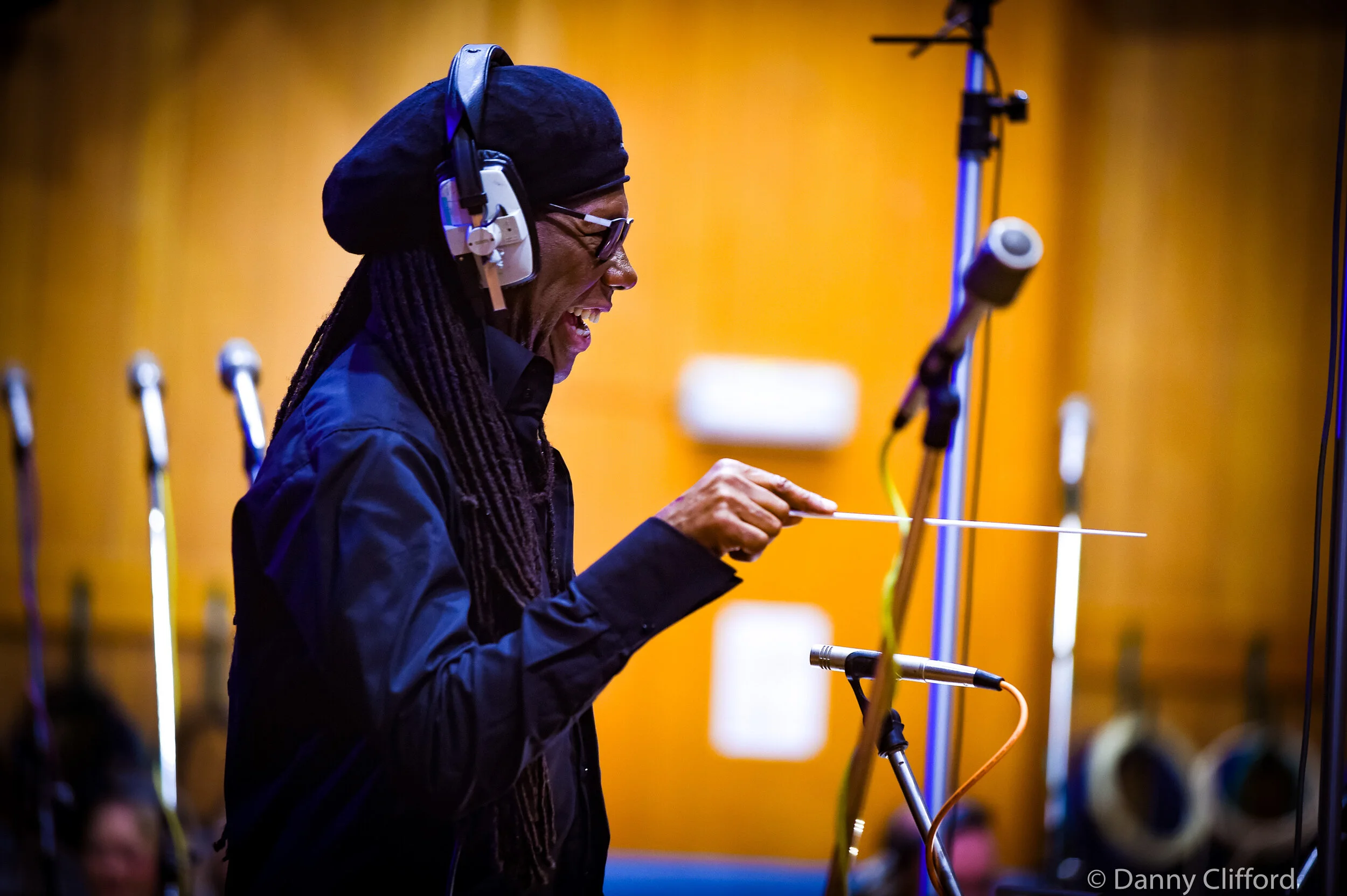 Nile conducting an orchestra at Abbey Road Studios.