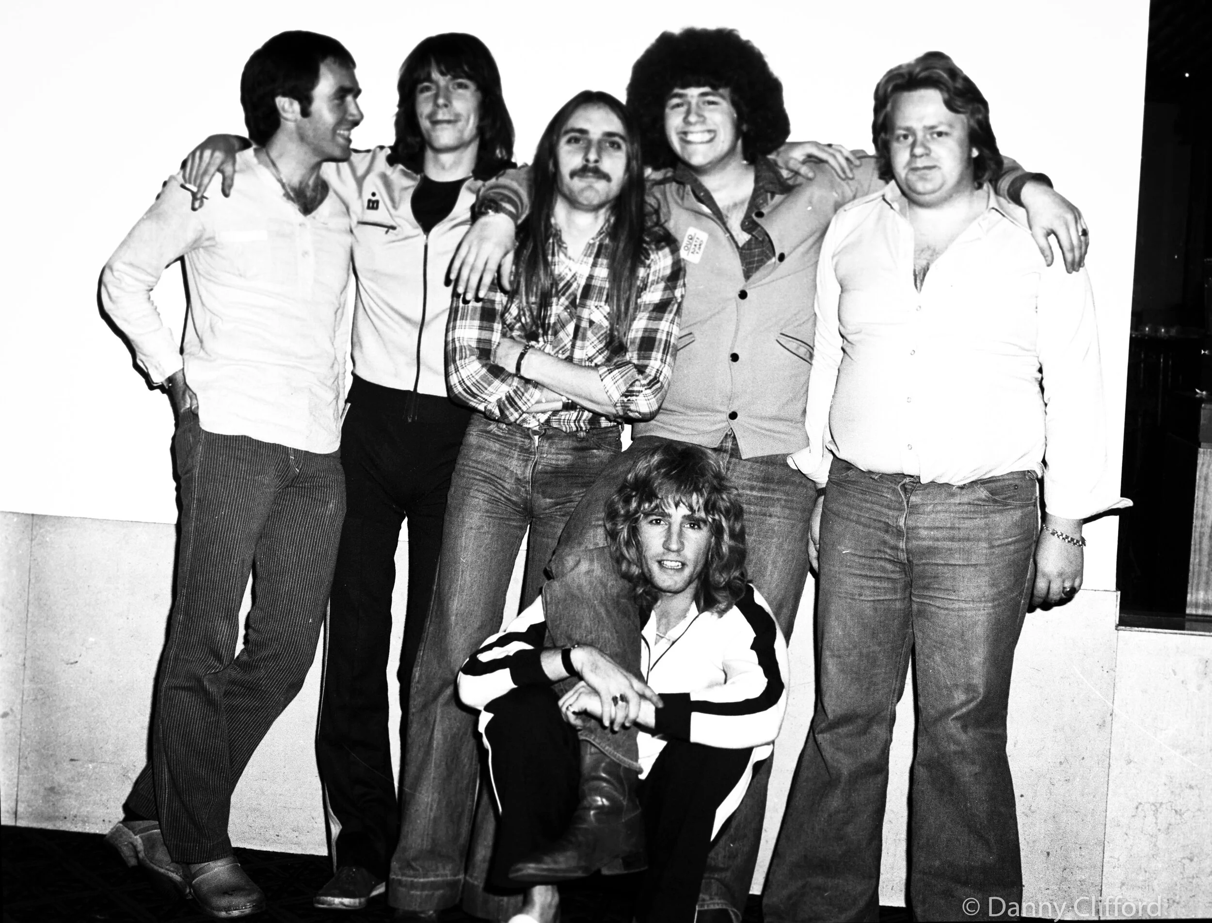 Now, I know where this was taken. It was the Albany Hotel, Glasgow, Scotland and I am in it, with hair. Yes, lenty of hair! L-R Bob Young, Andy Bown, John, me, Rick Parfitt holding my leg and one our drivers. Blimey, I cant remeber his name. I would imagine Bob Young or John will tell me his name when I speak to them next.