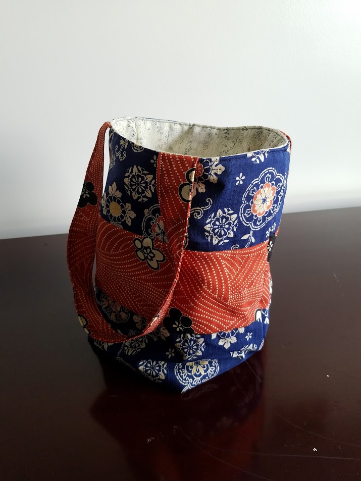 This structured tote is fully lined and the perfect size for anything from groceries to library books. 25" x 16" x 10"