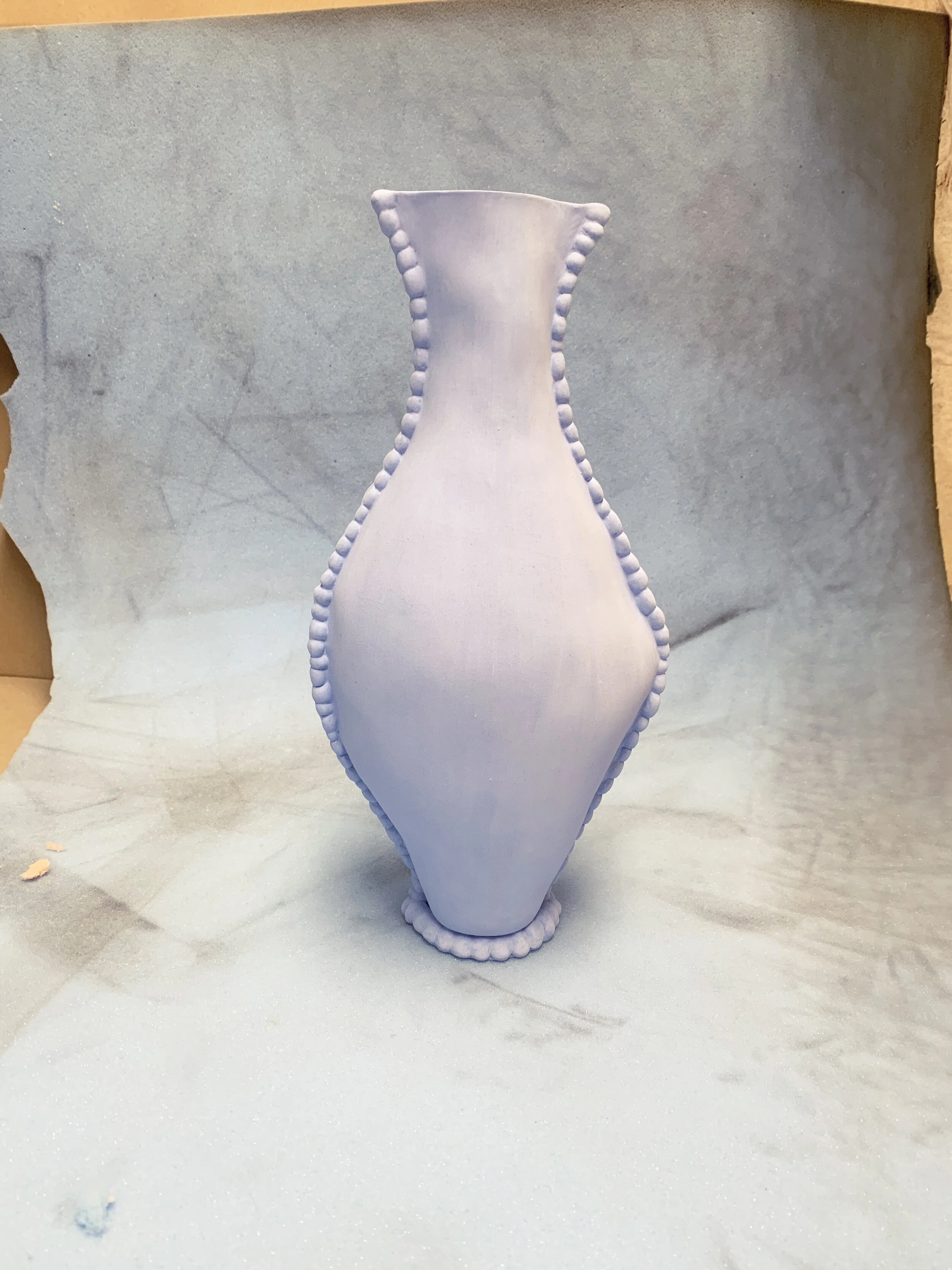 small blue urn on foam.jpg