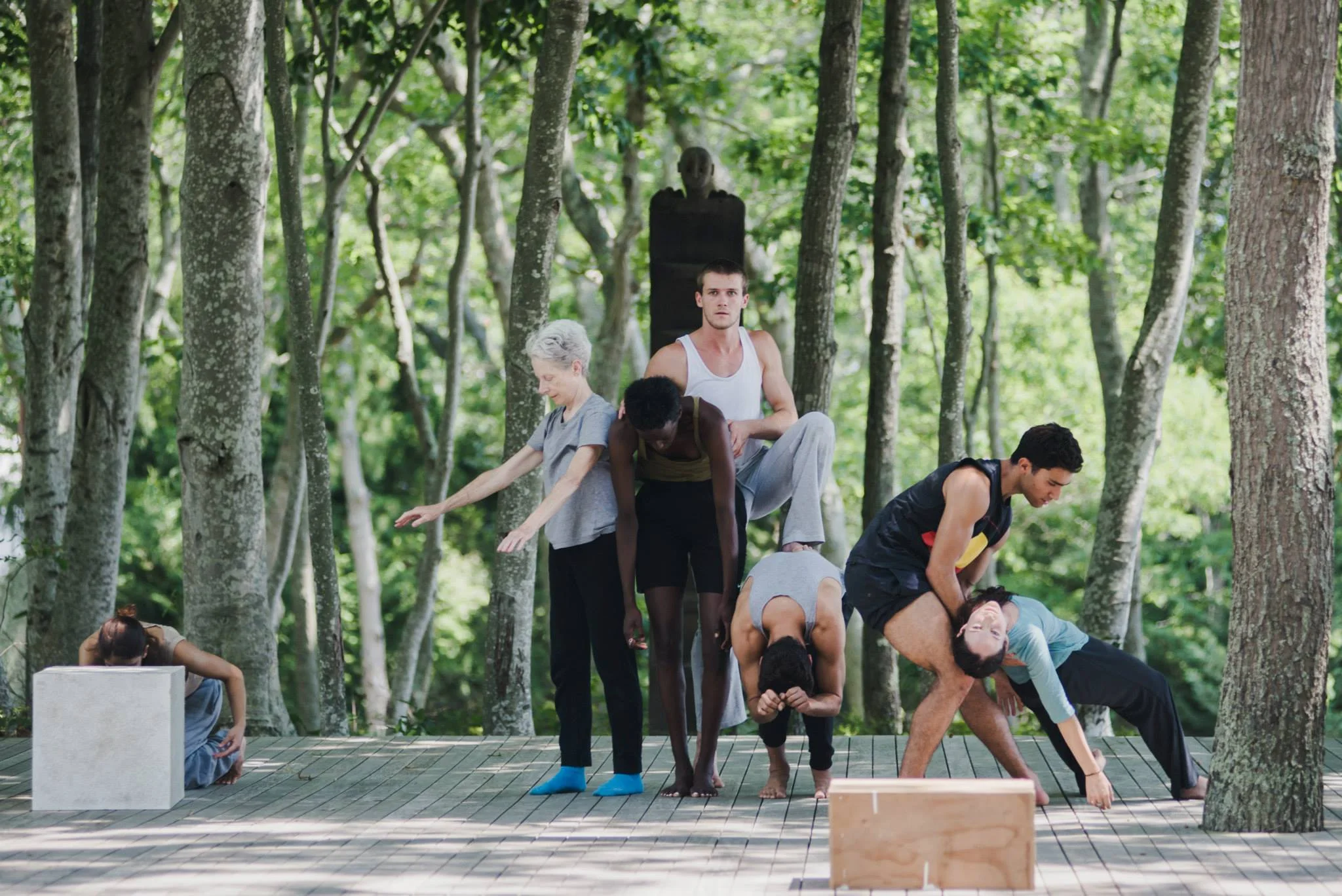 Timber platform among the trees. Designed for outdoor performances at the grounds of Watermill center. Photos by Kristian Kruuser.