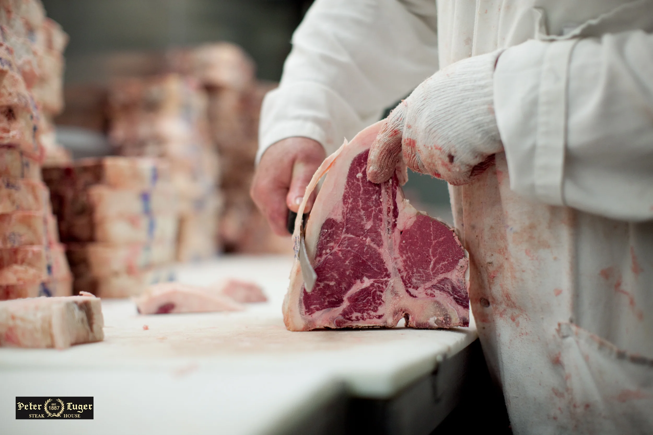 Peter Luger Steakhouse - Butcher Trimming Steak