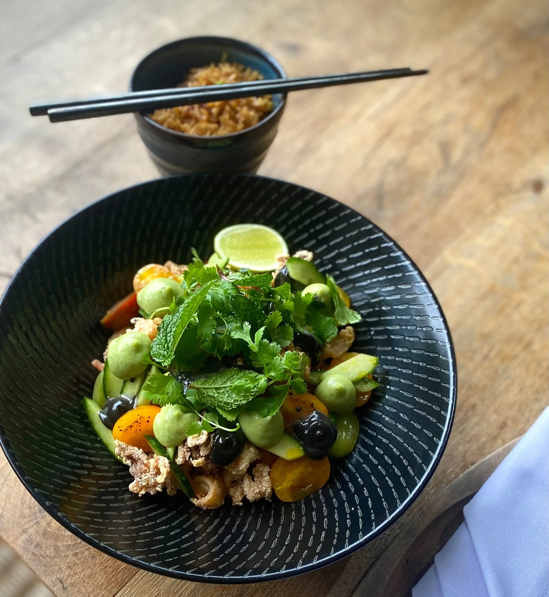 Crispy, fresh, and full of flavour. Our Squid is done right. 

Vibrant Herbs, a zesty Lime touch, and a smokey Squid Ink Aioli. Finished with avocado-lime pur&eacute;e and heirloom tomatoes for a dish that&rsquo;s as beautiful as it is delicious. 

?