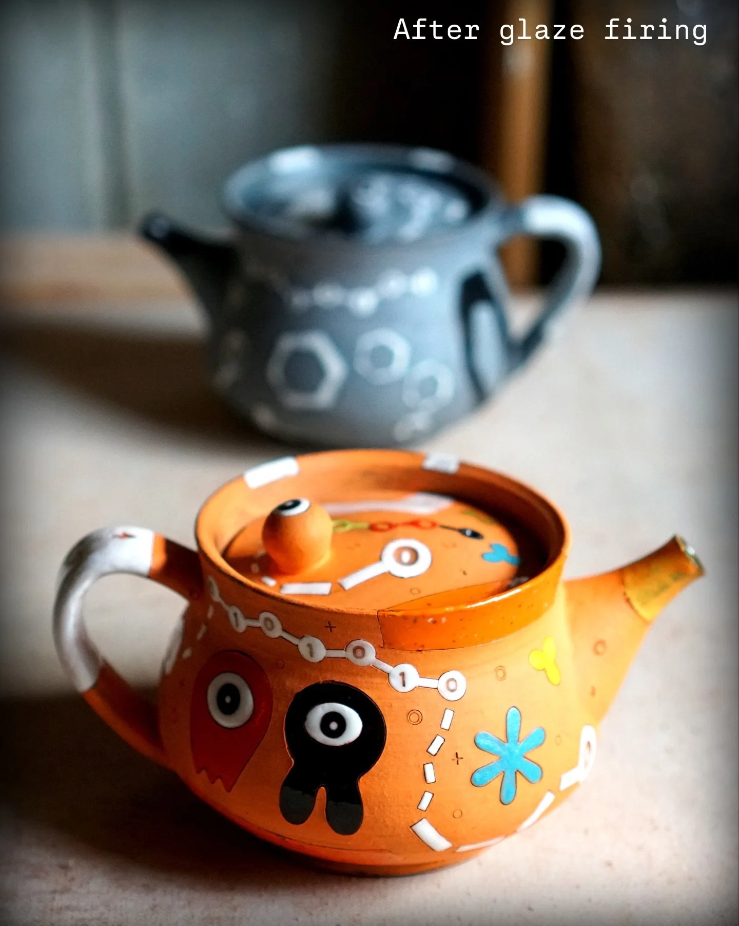 Regression Photos of the Teapots

I love making teapots, and here I&rsquo;d like to share a glimpse into the process through three stages:
1st photo &ndash; The finished teapots.
2nd photo &ndash; Surface design completed at the leather-hard stage.
3