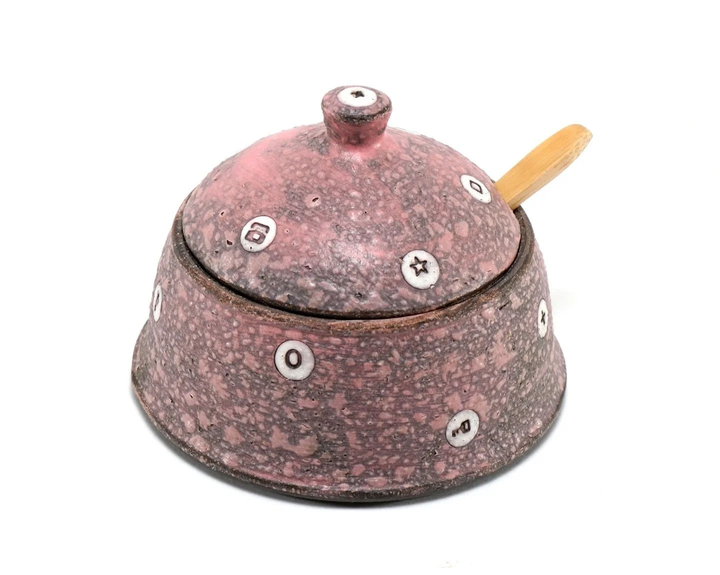 Pink Spice Jar

Sometimes unexpected accidents happen&mdash;and I end up loving the result.
This pink slip interacting with a matte clear glaze creates tiny surface bubbles that make the piece more visually and tangibly interesting.

Definitely a com