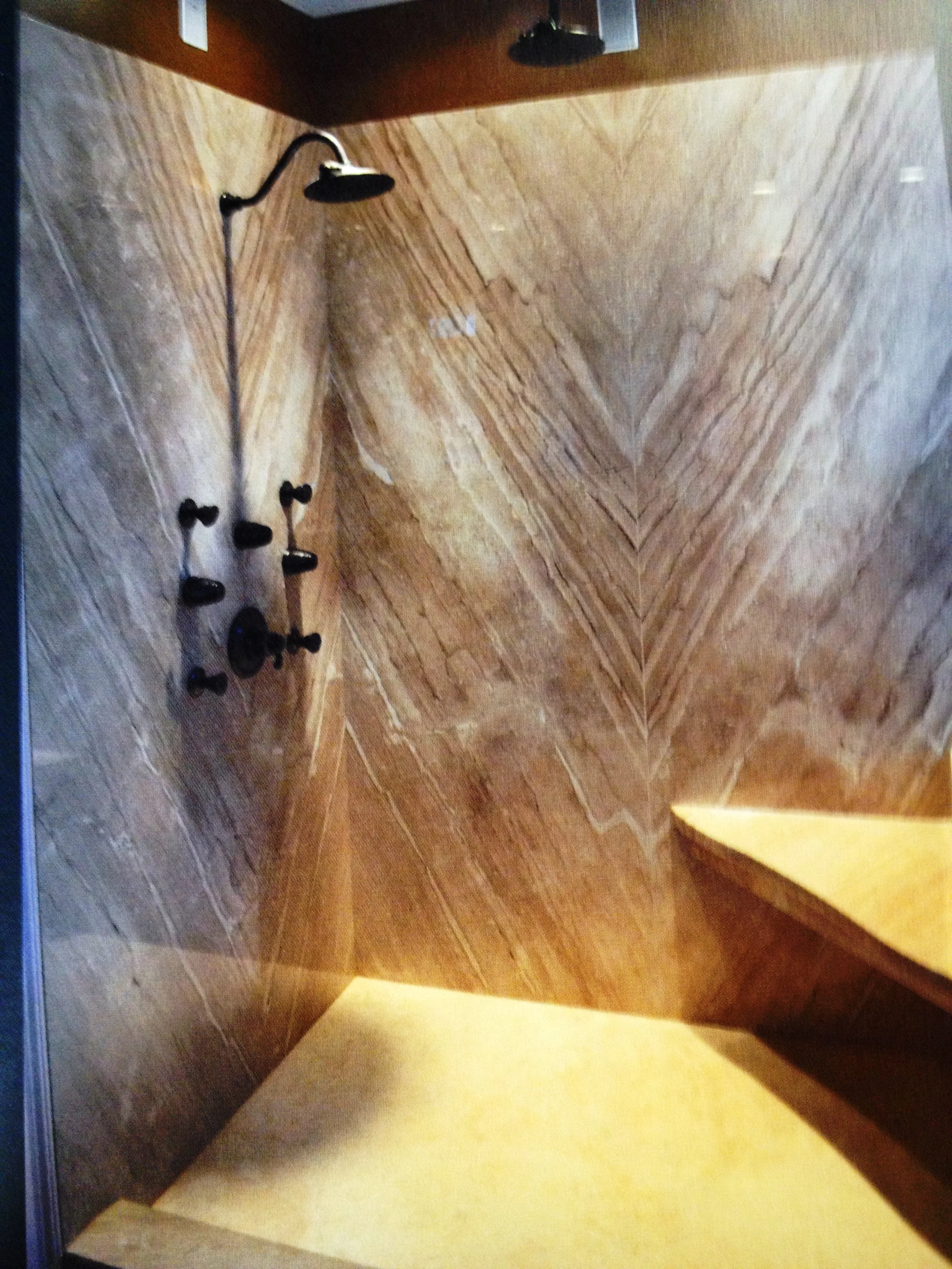 Four slabs of bookmatch Diano Reale marble and not a teaspoon of grout make up the master bath shower makeover. Cut to perfection!