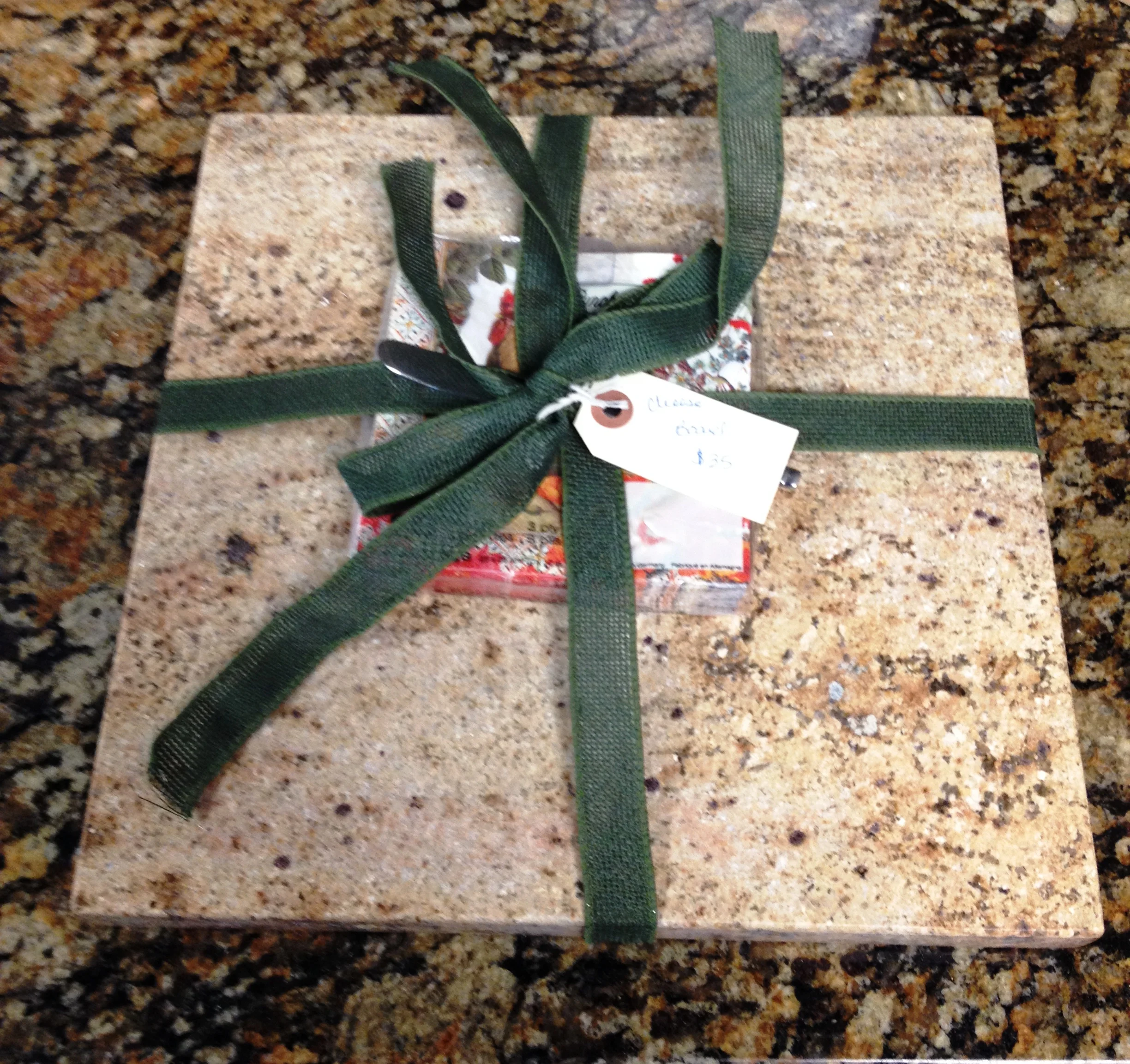 Cheese boards come with a cheese cutter and a matching or themed napkin set.
