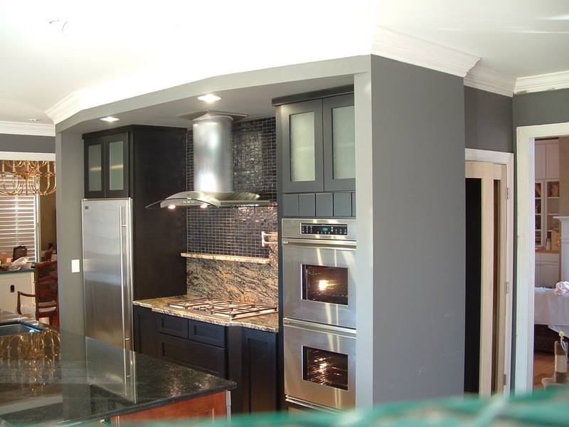 Mixing granite, stone and tile breaks up a modern space and adds depth.