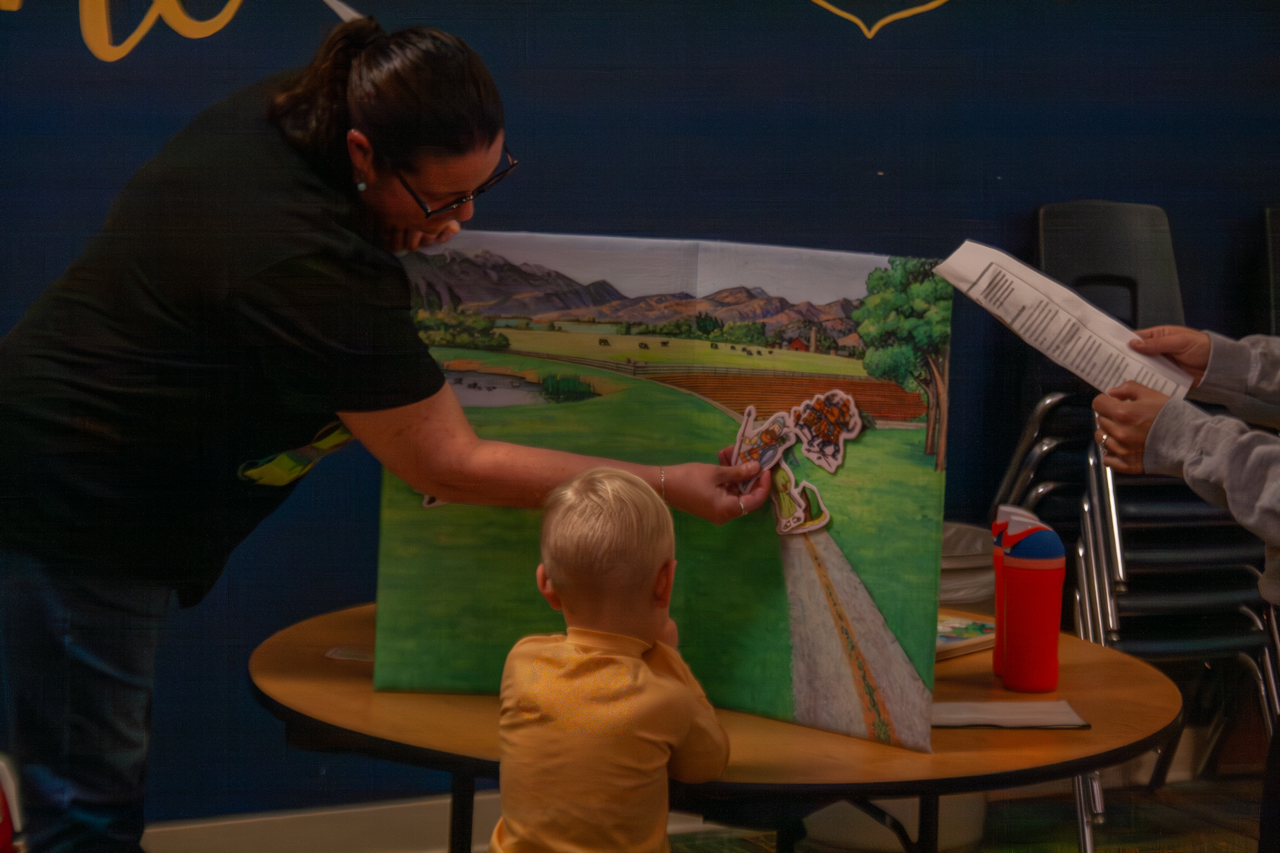 Early childhood 2025 field board with child.png