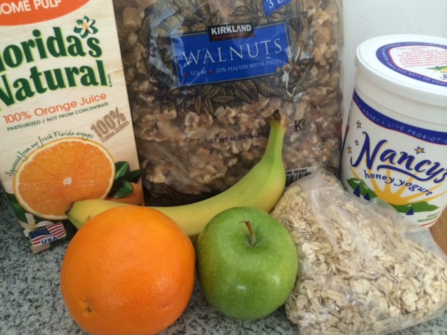 Soak the oats in OJ, add yogurt, chop and add any kind of fruit. Toast the walnuts in the micro for 1', then sprinkle on top. 