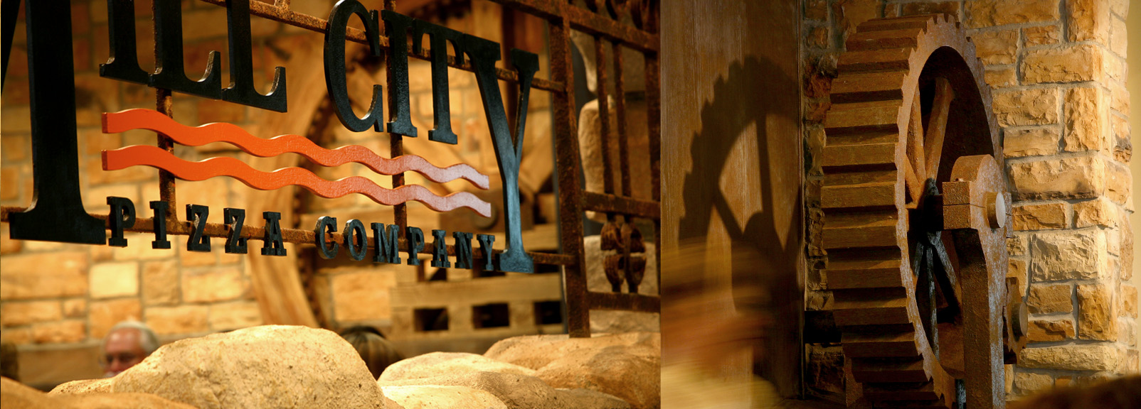 Wrought iron signage and water wheel.