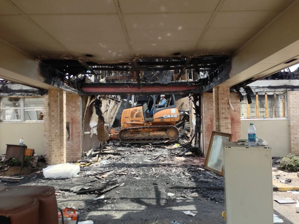 Demolition of the burned structure began on Monday, September 16, 2013. (Jeremy Hagood/ JFN)