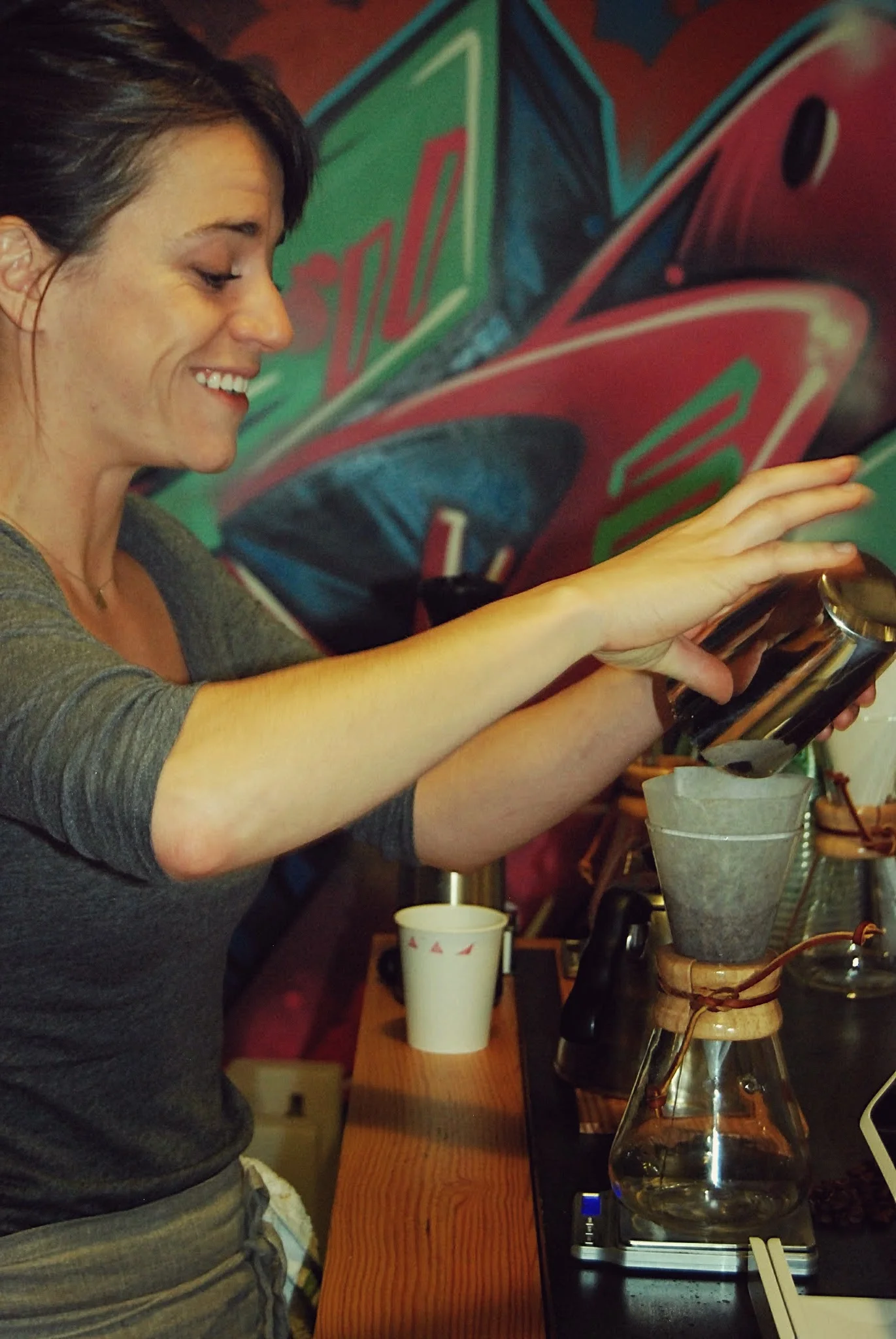 Annie Groff, Triangle Coffee co-founder, pours coffee into a Chemex.