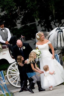 The reception was at the Winter Park Women’s Club–there were preserved wedding gowns worn by relatives in the past, placed on antique dress forms, and wedding portraits of Grandpas and Grandmas, parents, etc.