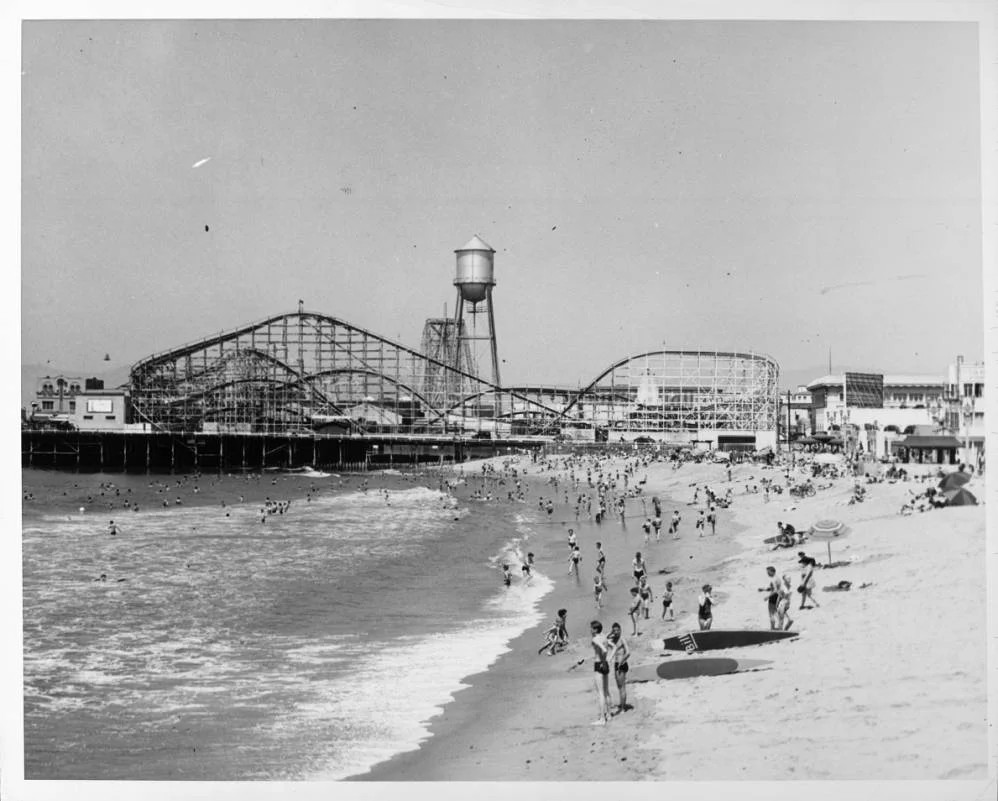 People_frolic_on_the_beach_near_the_roller_coaster_in_the_amusement_park_at_Venice_Beach_1940.jpg