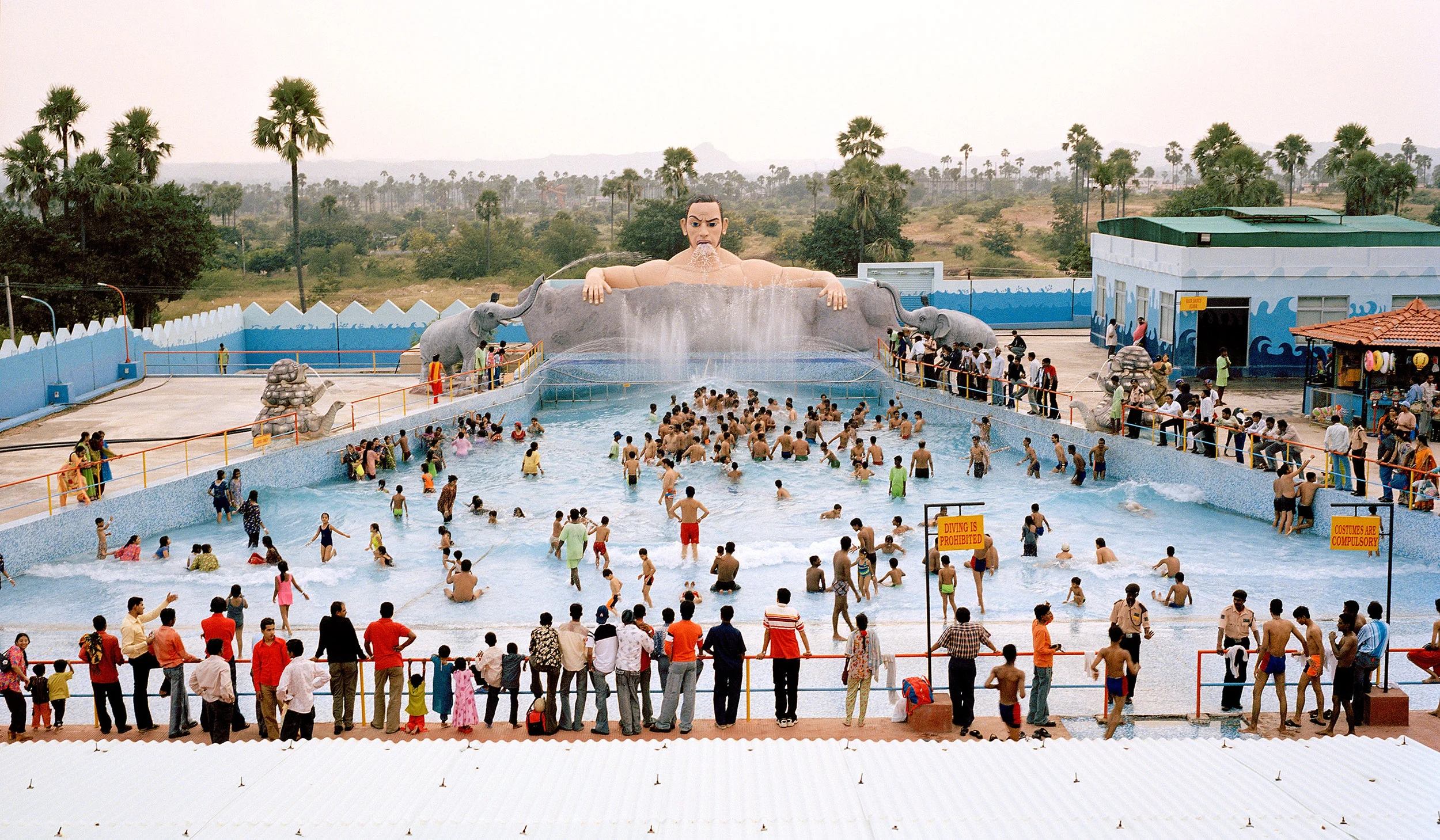 indian tourists in crowded swimming pool wave machine ocean world theme park hyderabad india