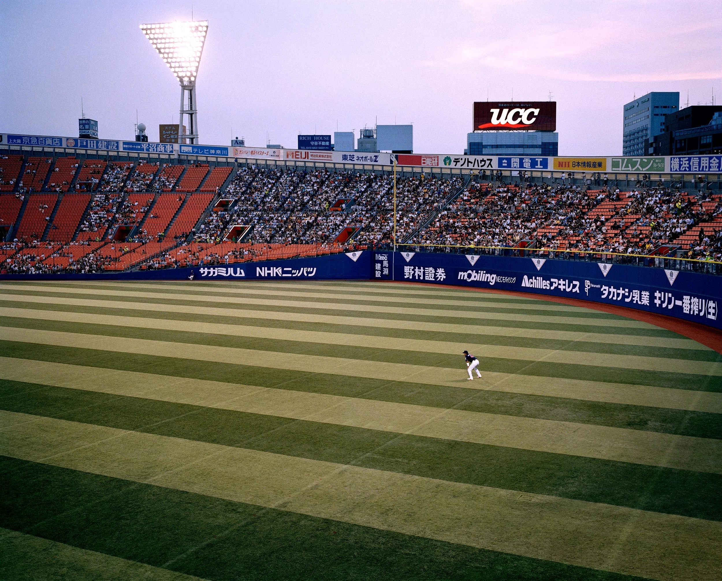 baseball player at evening baseball game Yokohama stadium japan