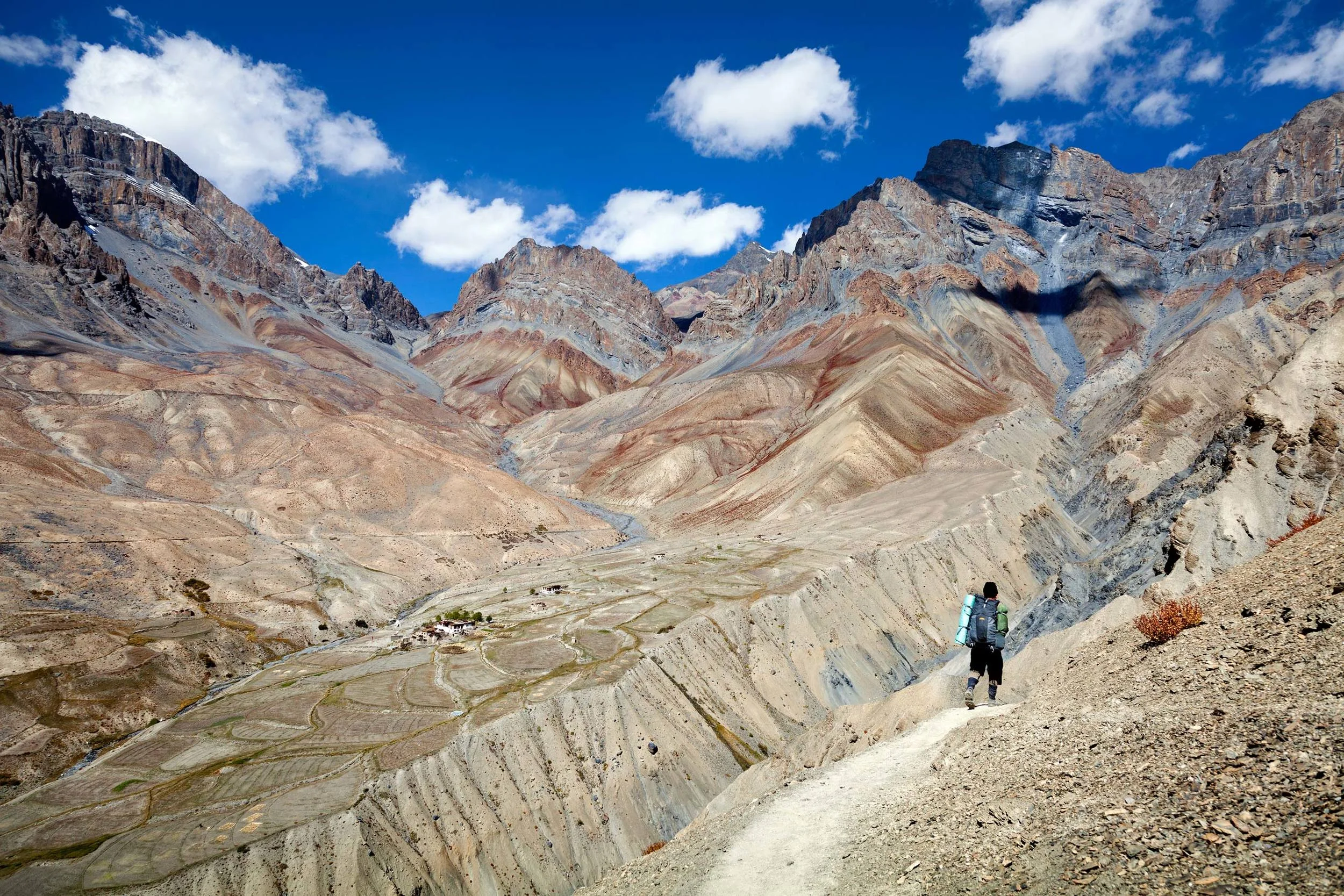 Zanskari porter on trail approach to Gongma village Zanskar Ladakh