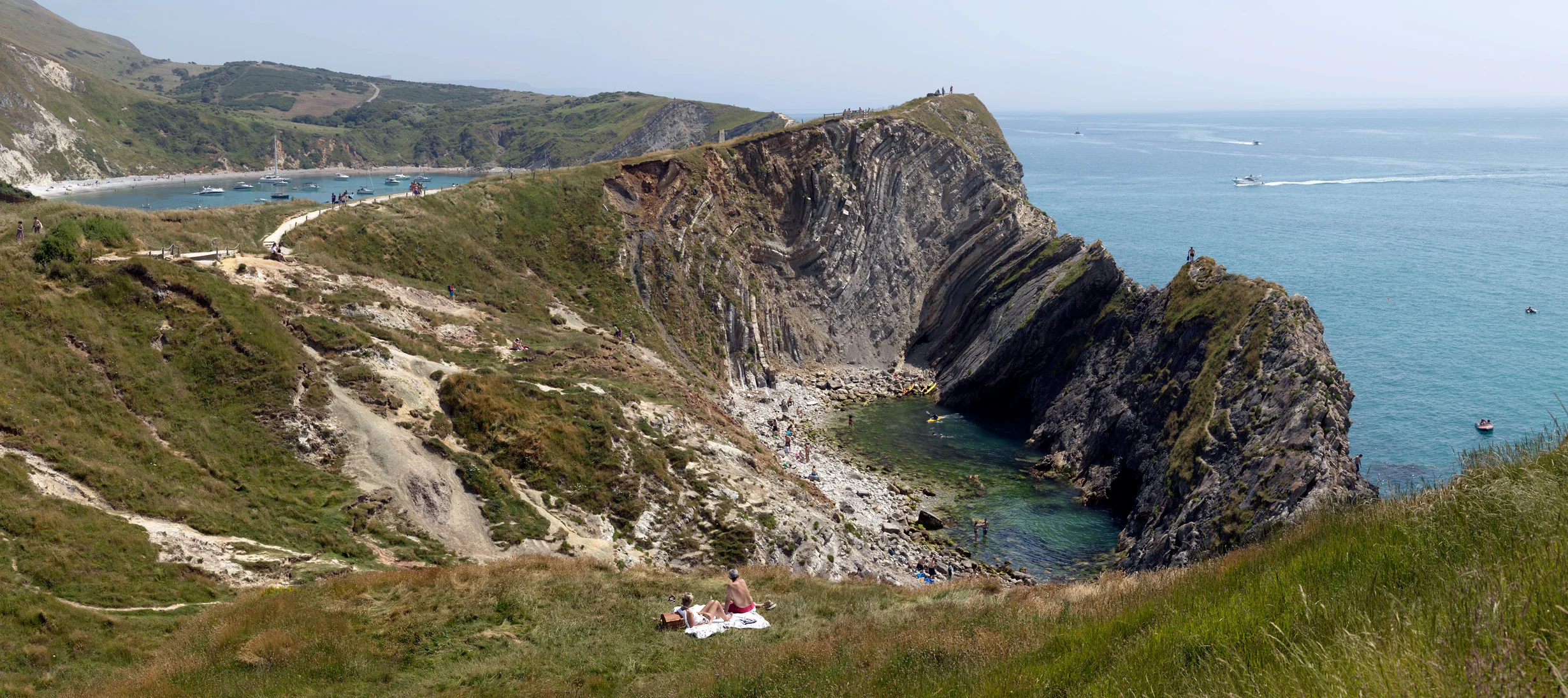 couple picnic with view of stair hole lagoon lulworth cove