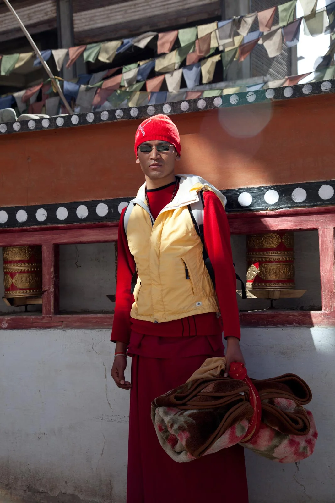 dunkmckenzie-highlight-ladakh-modern-monk-by-prayer-wheels-leh-ladakh.jpg