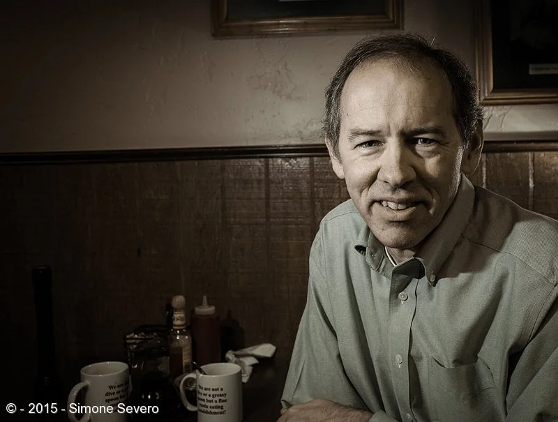 Dave is kind of a a mentor. We met for breakfast and I asked him to be my portrait of the day. He&nbsp;said he was afraid I was going to ask for that,&nbsp;but he agreed. He teaches&nbsp;photography, just like me, and he has a very exact brain. His …