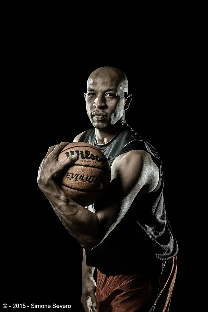 I met Anthony in a basketball court and I immediately knew I was going to invite him for Portrait a Day. He is the nicest person, making a real difference in this life by coaching basketball to kids. I had this vision of a dramatic light around him …