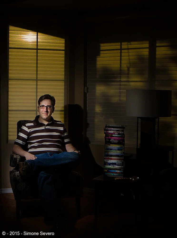 Ryan and I met 5 minutes before this picture. He opened the door and he was expecting me, as his mother told him the photographer needed a volunteer for the Portrait a Day project.I asked him what was his passion and he said he collects comic books …