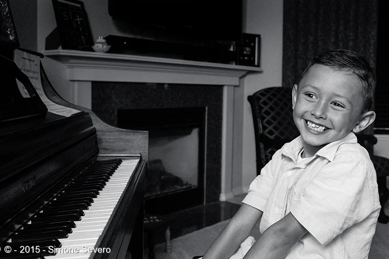 Marcelo started playing the piano when he was 3. His grandma got him started twice a week while he was on vacation with her. He is almost 7 years&nbsp;old now and he still loves music. While I was photographing him he was smiling and giggling the ti…
