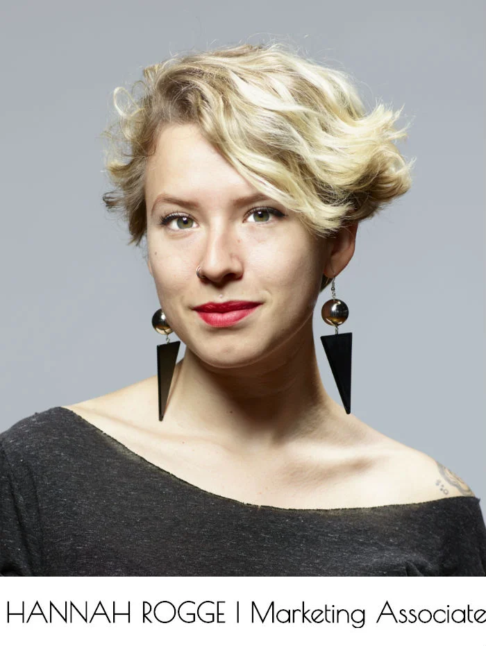 Hannah Rogge, Marketing Associate, looks into the camera. Their head and shoulders are visible.