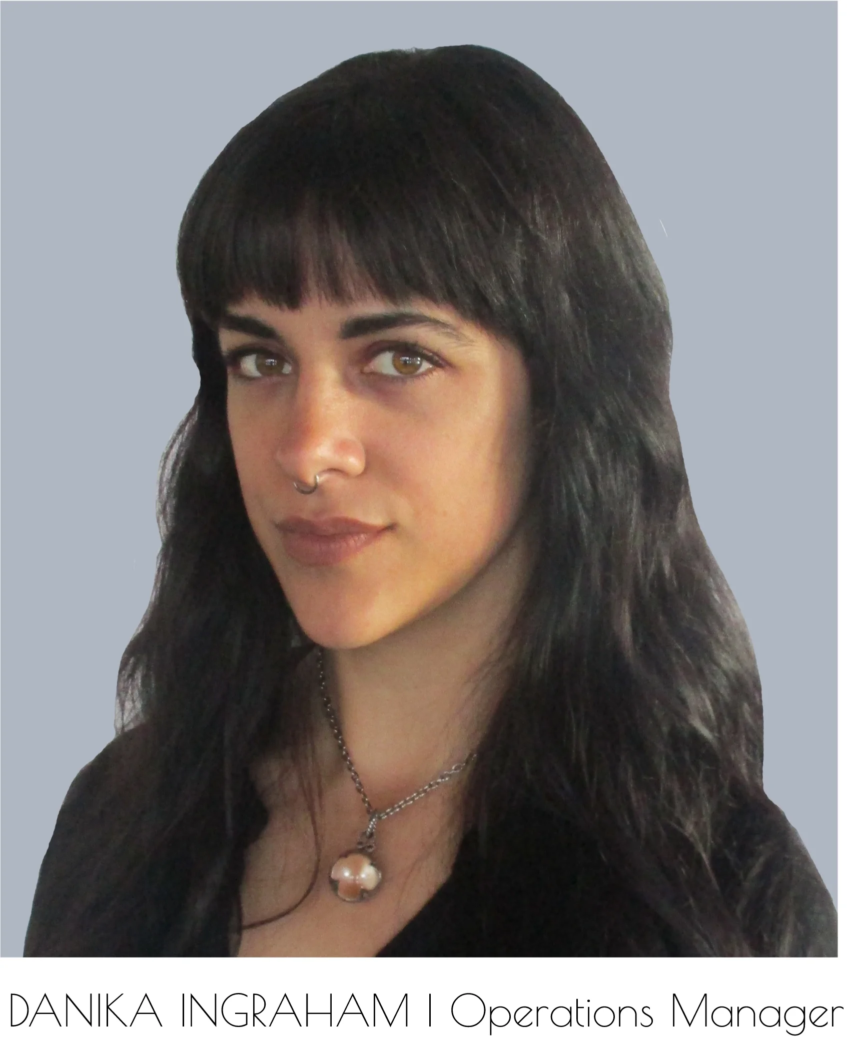 Breanna Lee, Company Administrator, looks into the camera. Her head and shoulders are visible.