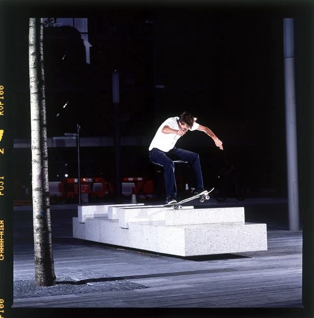 Nick Jensen traverses a granite bench with a switch frontside nosegrind in London, England. Photo by Dominic Marley